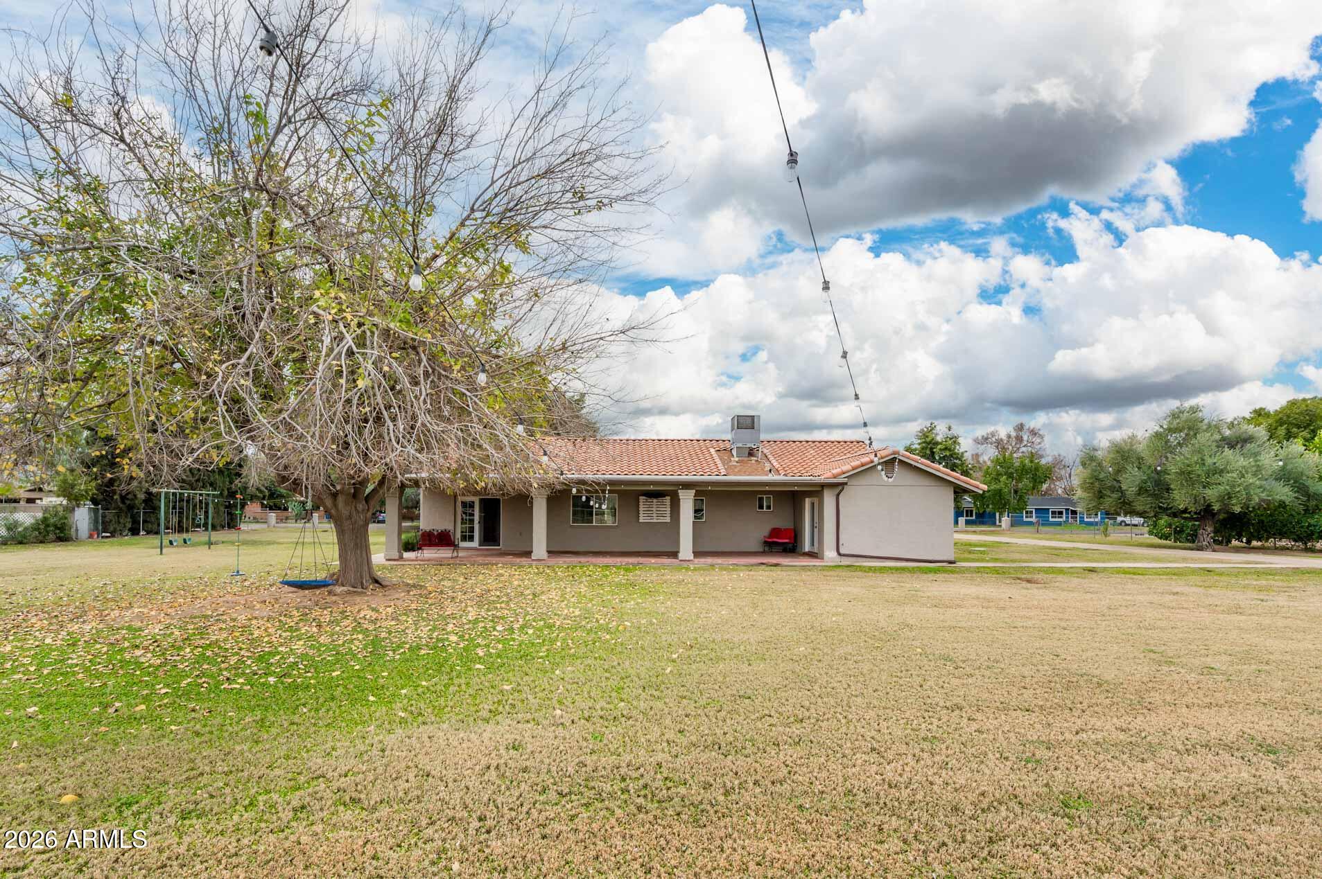 4730 West Piedmont Road Laveen, AZ 85339 - Photo 62 of 65 a view of a house with a yard