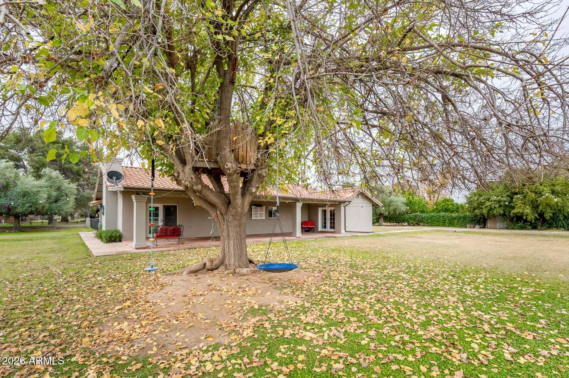 4730 West Piedmont Road Laveen, AZ 85339 - Photo 63 of 65 a house with trees in front of it