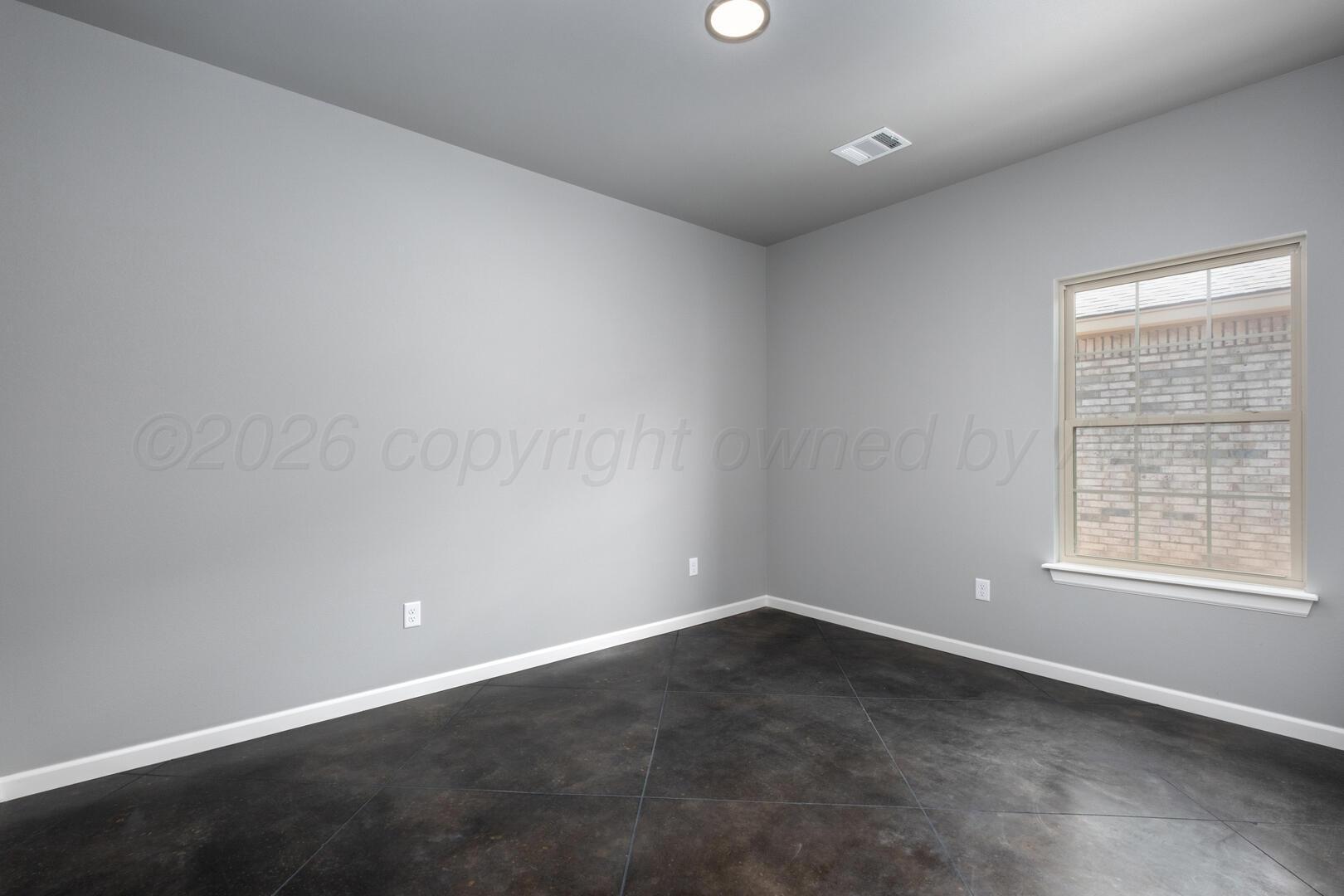 10307 Ruse Street Amarillo, TX 79118 - Photo 9 of 23 an empty room with a window