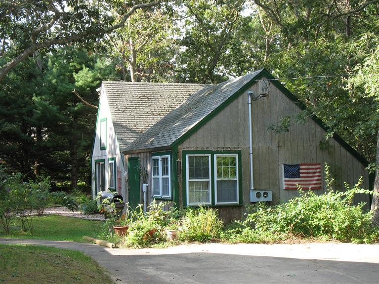 40 Deerfield Lane Eastham, MA 02642 - Photo 2 of 11 front view of a house with a yard