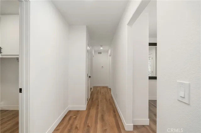 a view of a bathroom from a hallway