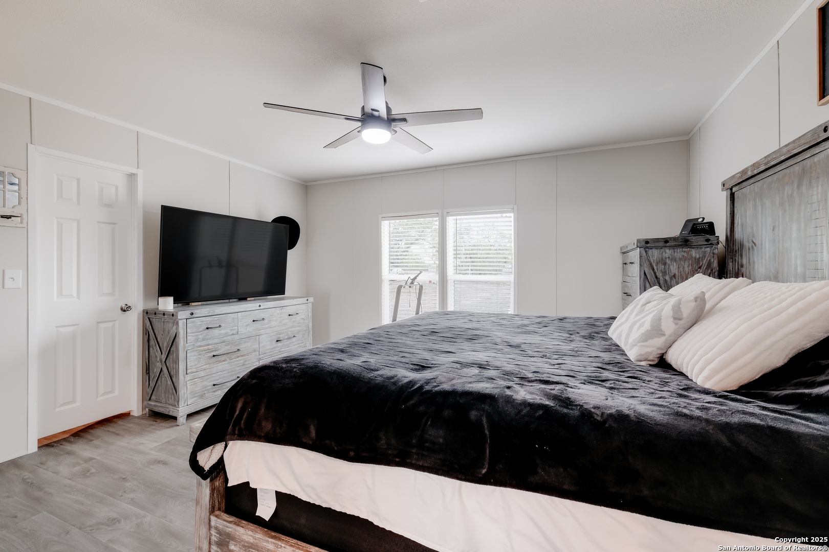 753 Pr Riley Lane Charlotte, TX 78011 - Photo 11 of 22 a bedroom with a bed and a flat screen tv