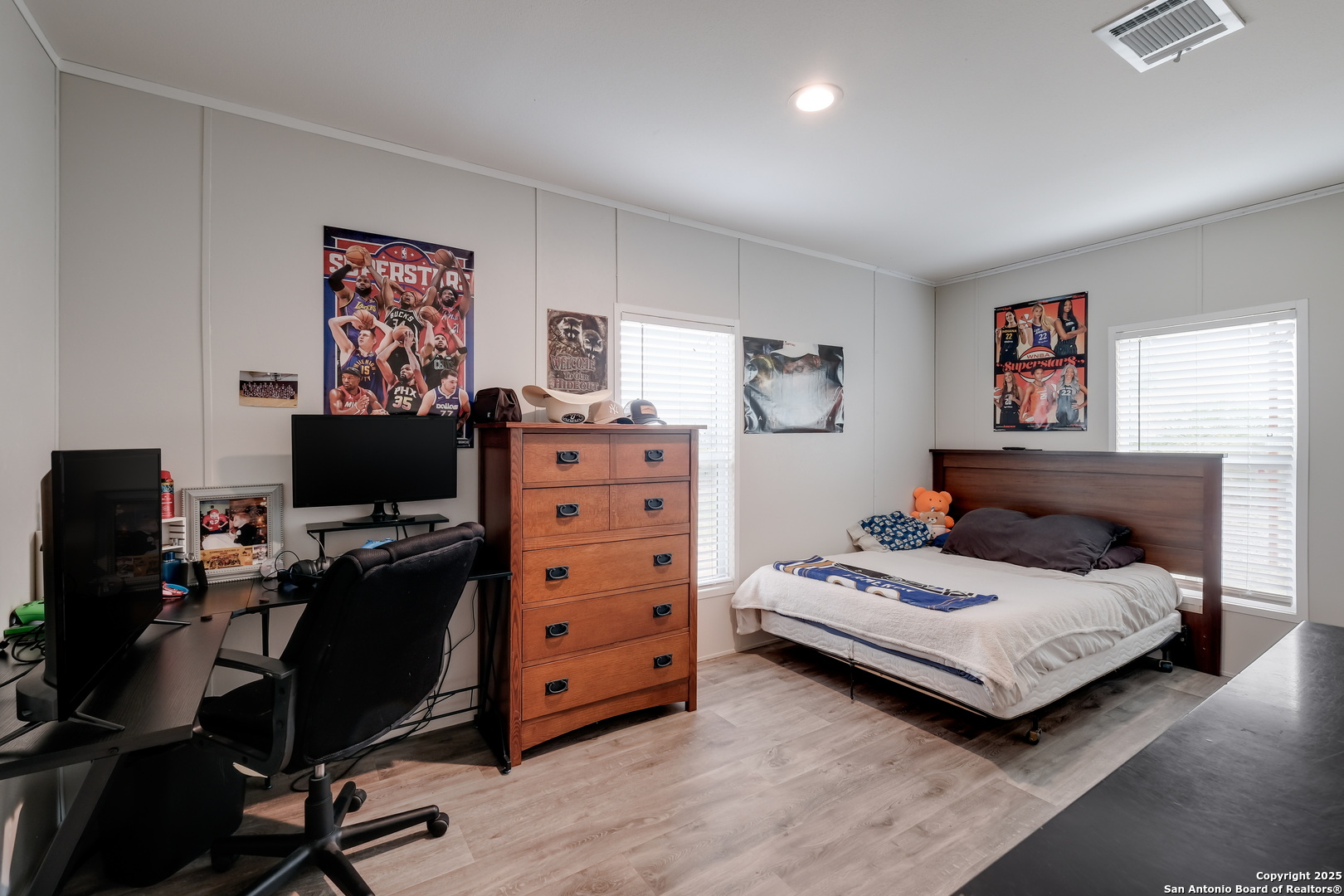 753 Pr Riley Lane Charlotte, TX 78011 - Photo 13 of 22 a bedroom with a bed and a desk