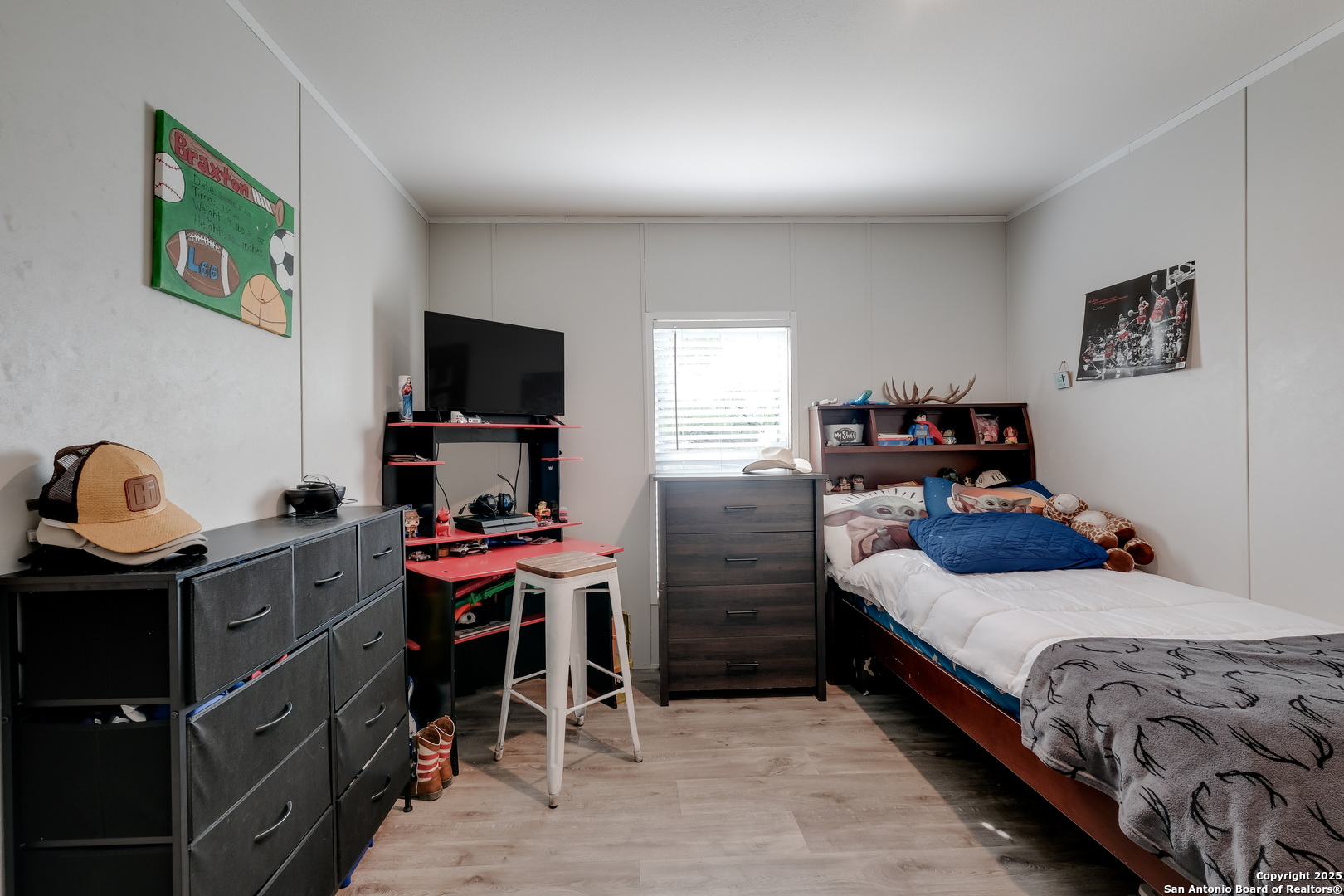 753 Pr Riley Lane Charlotte, TX 78011 - Photo 17 of 22 a bedroom with a bed and a flat screen tv