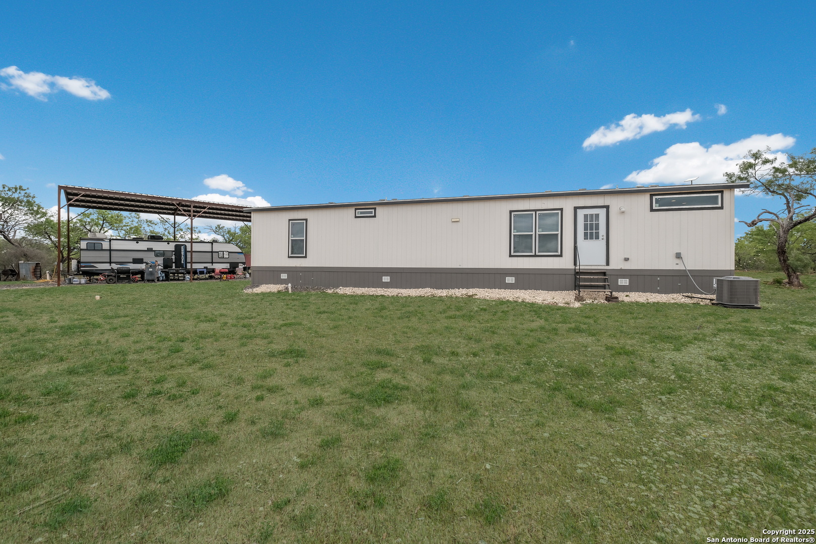 753 Pr Riley Lane Charlotte, TX 78011 - Photo 20 of 22 a house view with a outdoor space