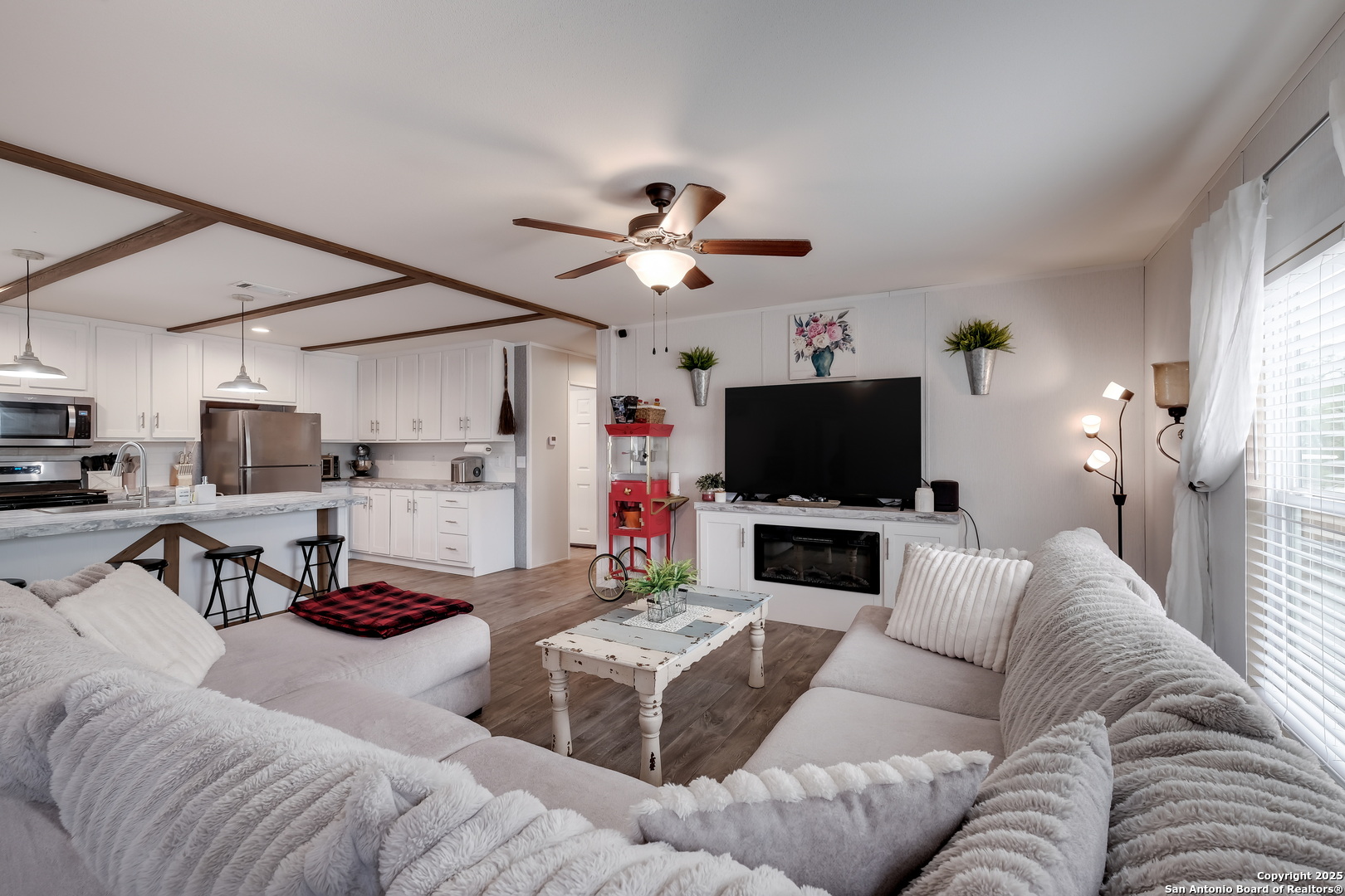 753 Pr Riley Lane Charlotte, TX 78011 - Photo 2 of 22 a living room with furniture and a flat screen tv