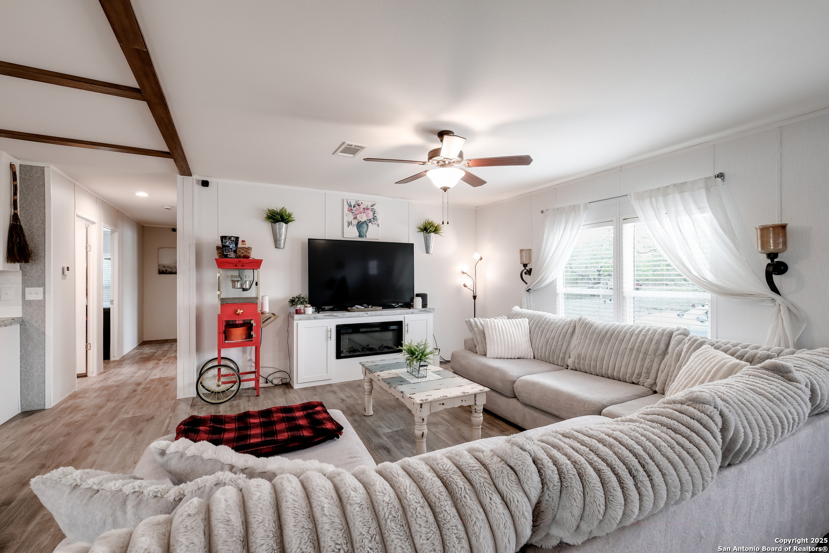 753 Pr Riley Lane Charlotte, TX 78011 - Photo 3 of 22 a living room with furniture a flat screen tv and a window