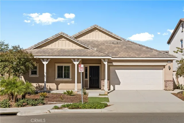 a living room with couches and a flat screen tv