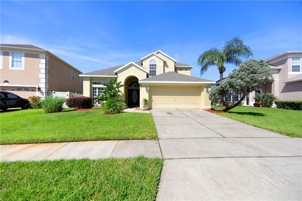 241 Tavestock Loop Winter Springs, FL 32708 - Photo 1 of 1 a front view of house with yard and green space