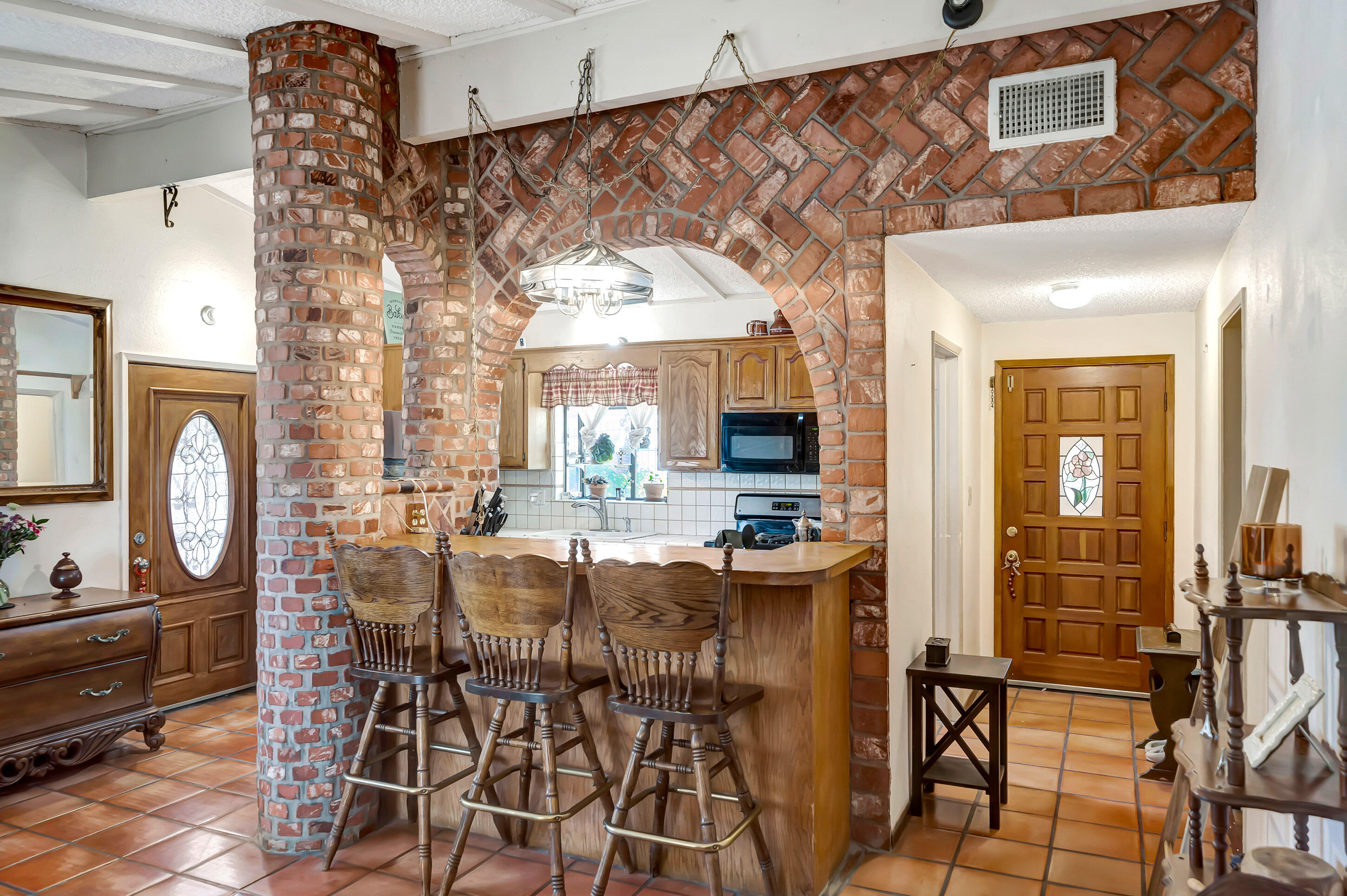 1617 Elizabeth Lake Road Palmdale, CA 93551 - Photo 11 of 45 a view of a dining room with furniture and chandelier