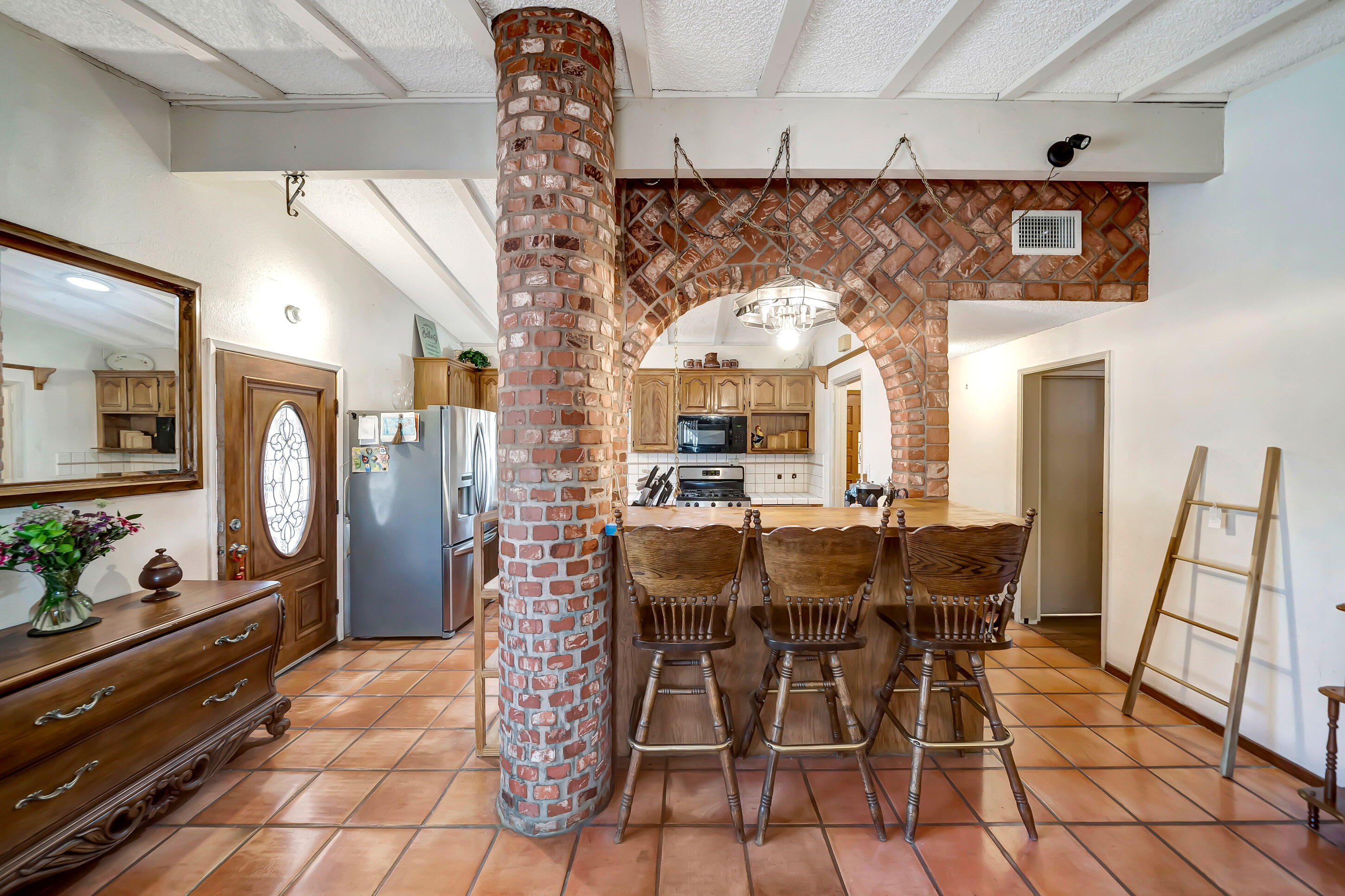 1617 Elizabeth Lake Road Palmdale, CA 93551 - Photo 12 of 45 a view of a dining room with furniture and chandelier