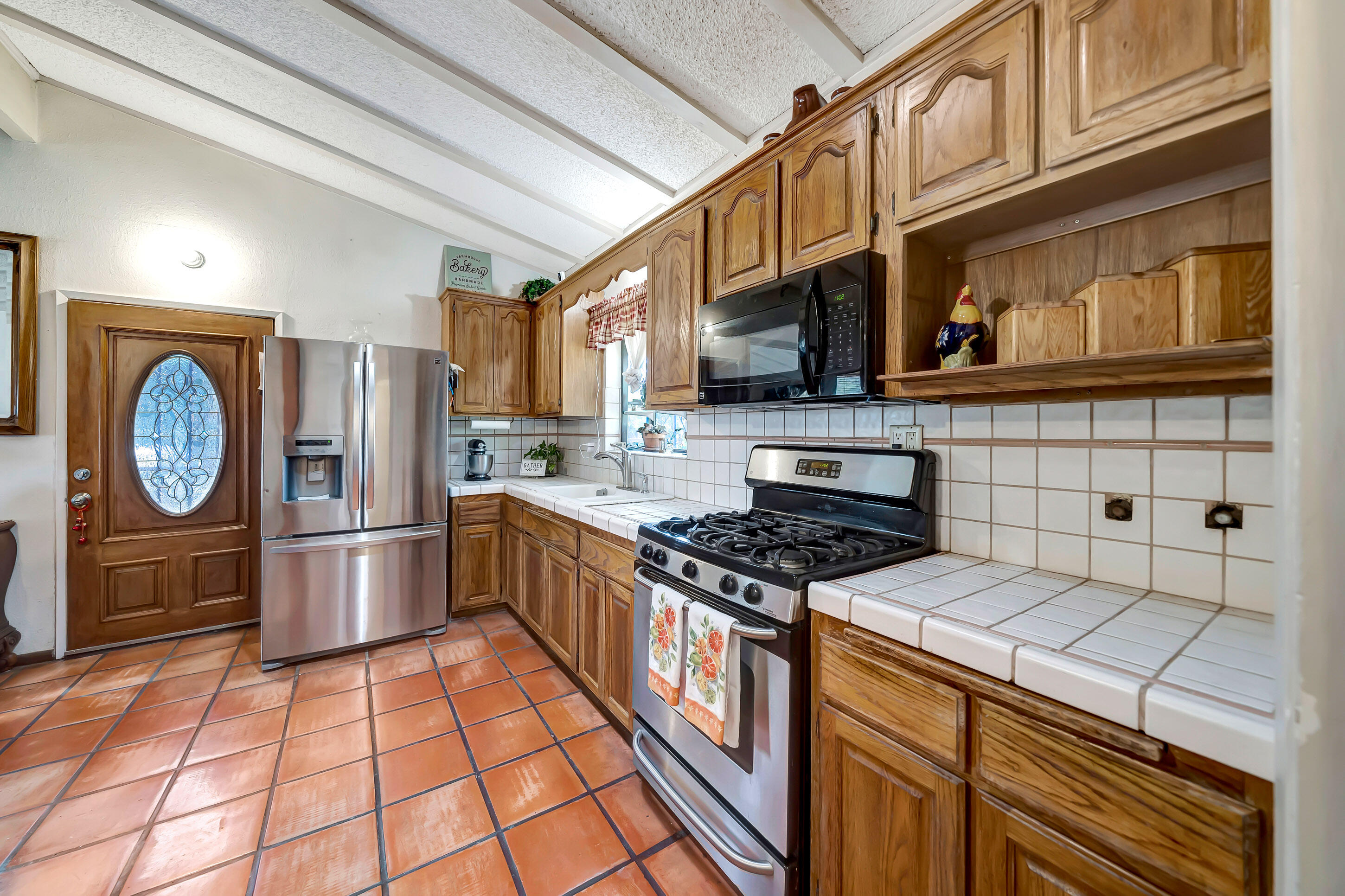 1617 Elizabeth Lake Road Palmdale, CA 93551 - Photo 13 of 45 a kitchen with stainless steel appliances granite countertop a stove a refrigerator and a cabinets