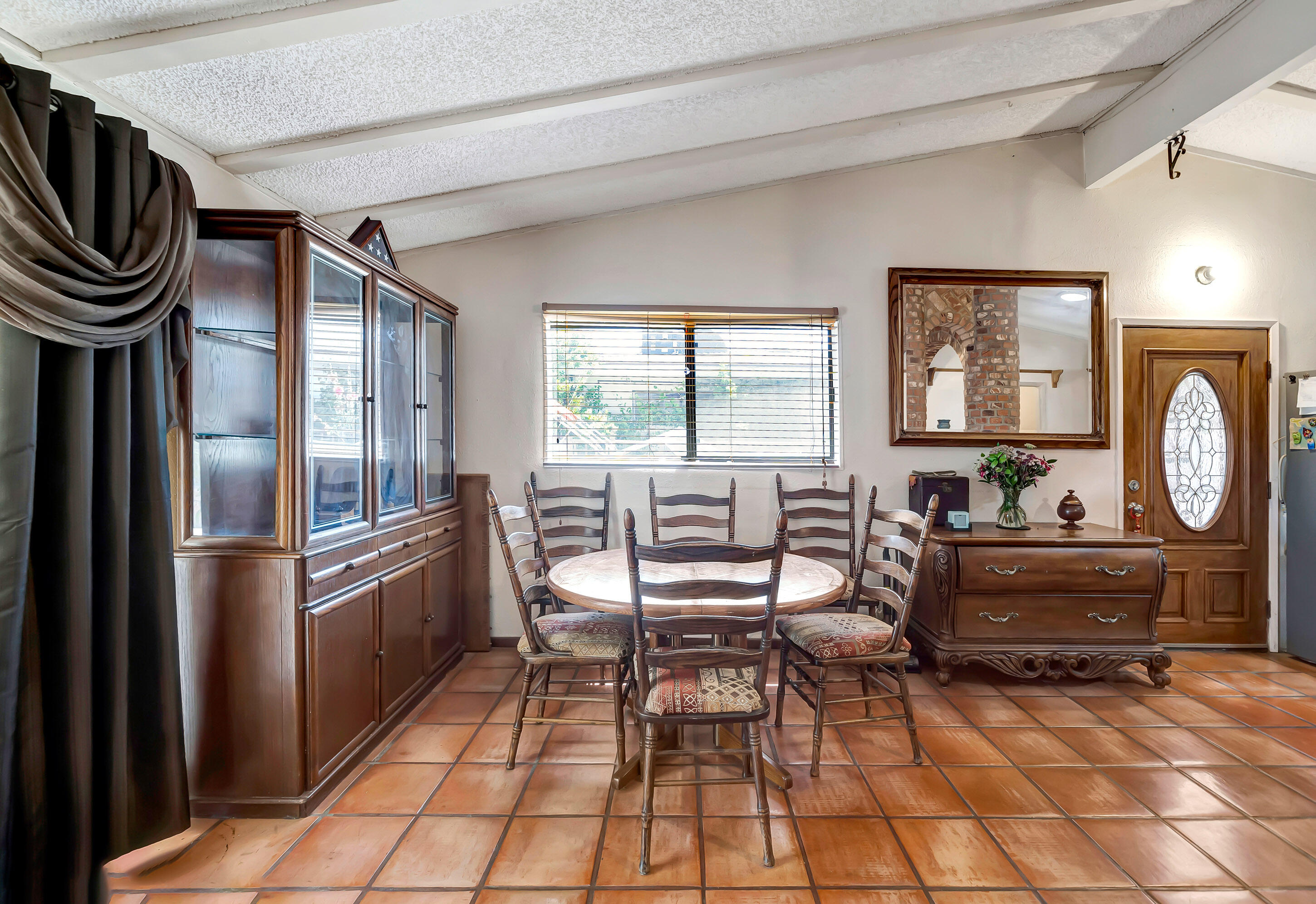 1617 Elizabeth Lake Road Palmdale, CA 93551 - Photo 18 of 45 a kitchen with granite countertop a refrigerator and furniture