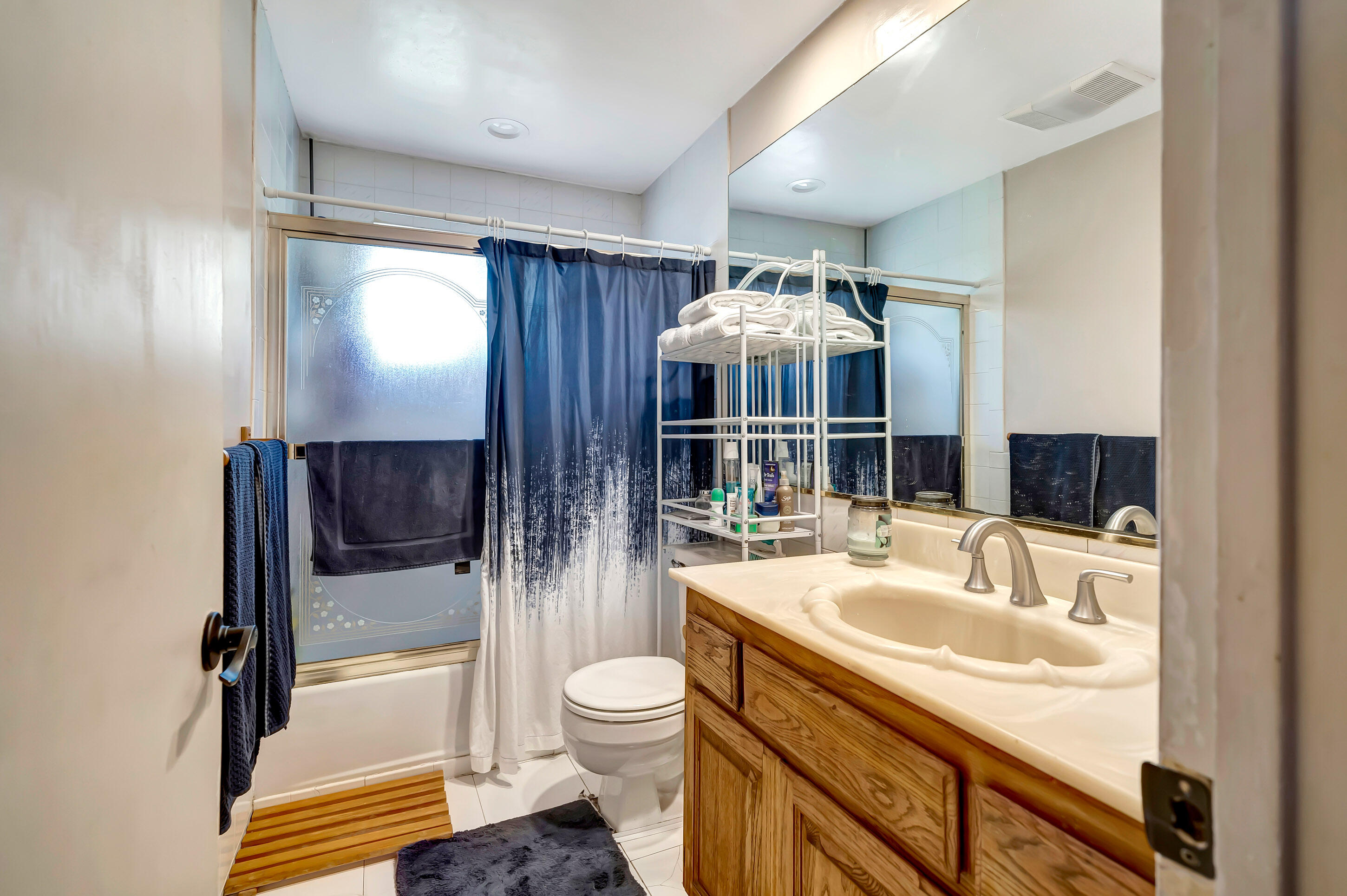 1617 Elizabeth Lake Road Palmdale, CA 93551 - Photo 19 of 45 a bathroom with a sink a toilet and shower