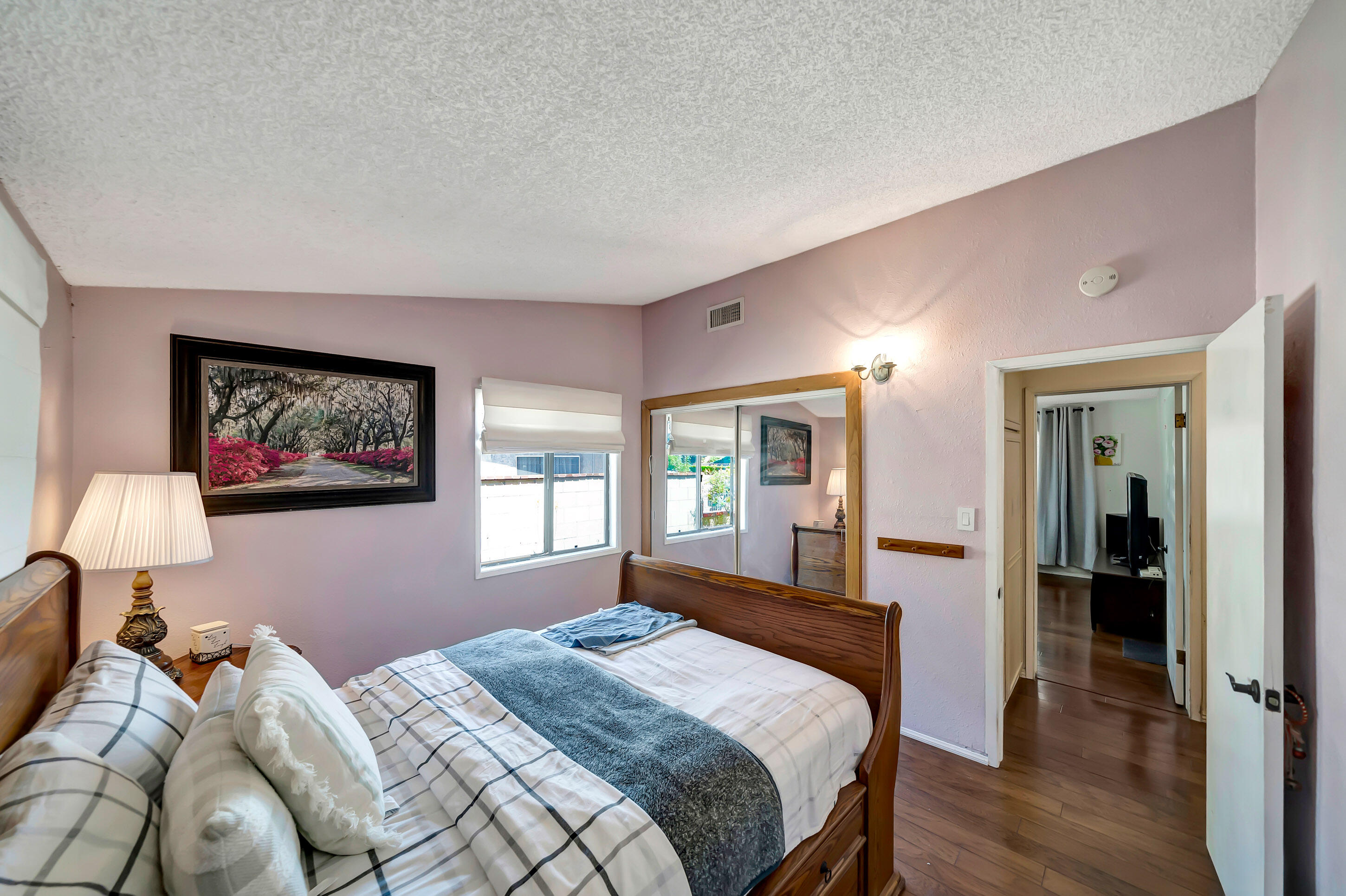 1617 Elizabeth Lake Road Palmdale, CA 93551 - Photo 24 of 45 a bedroom with a large bed and a window