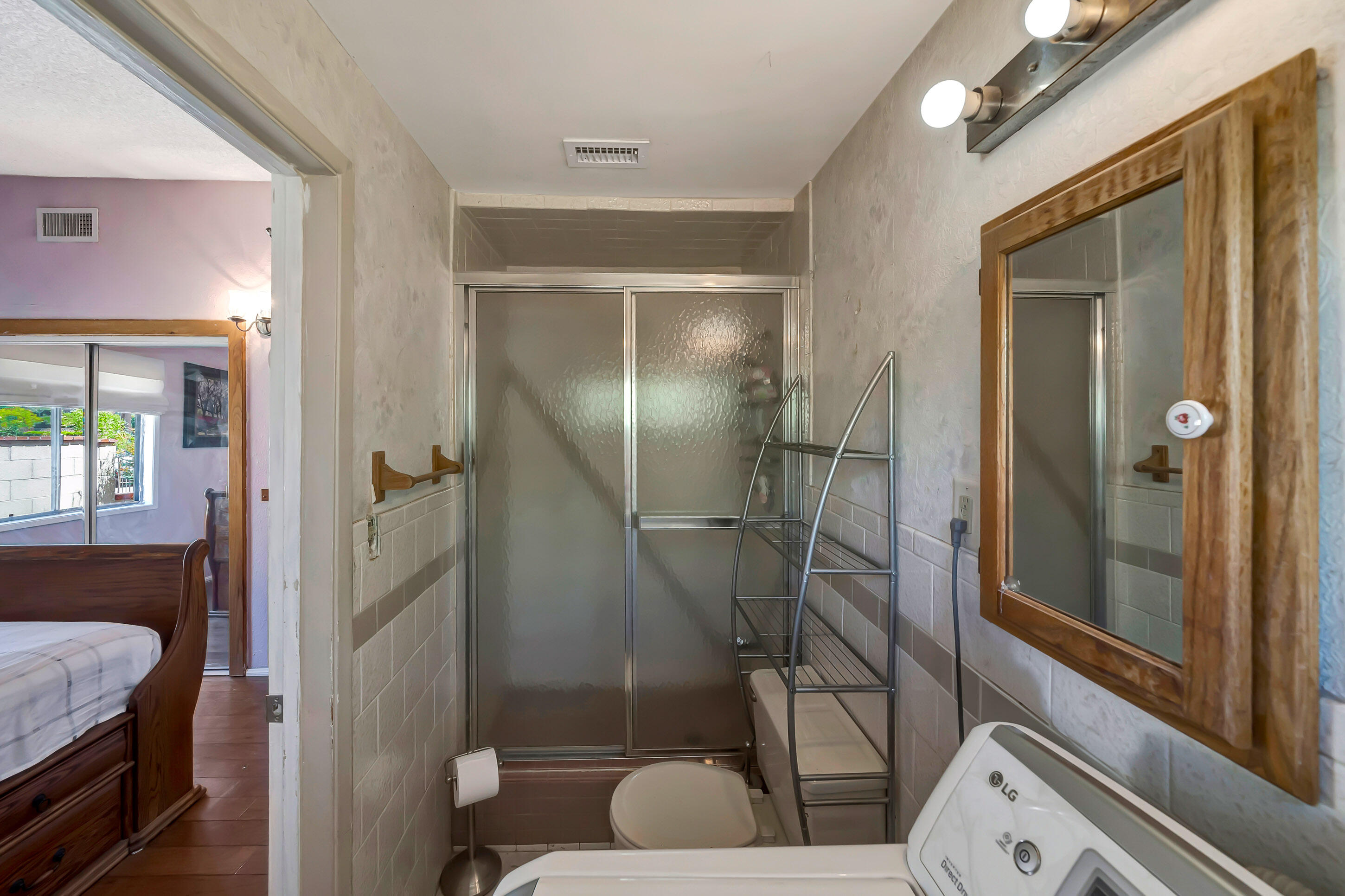 1617 Elizabeth Lake Road Palmdale, CA 93551 - Photo 26 of 45 a bathroom with a tub and shower