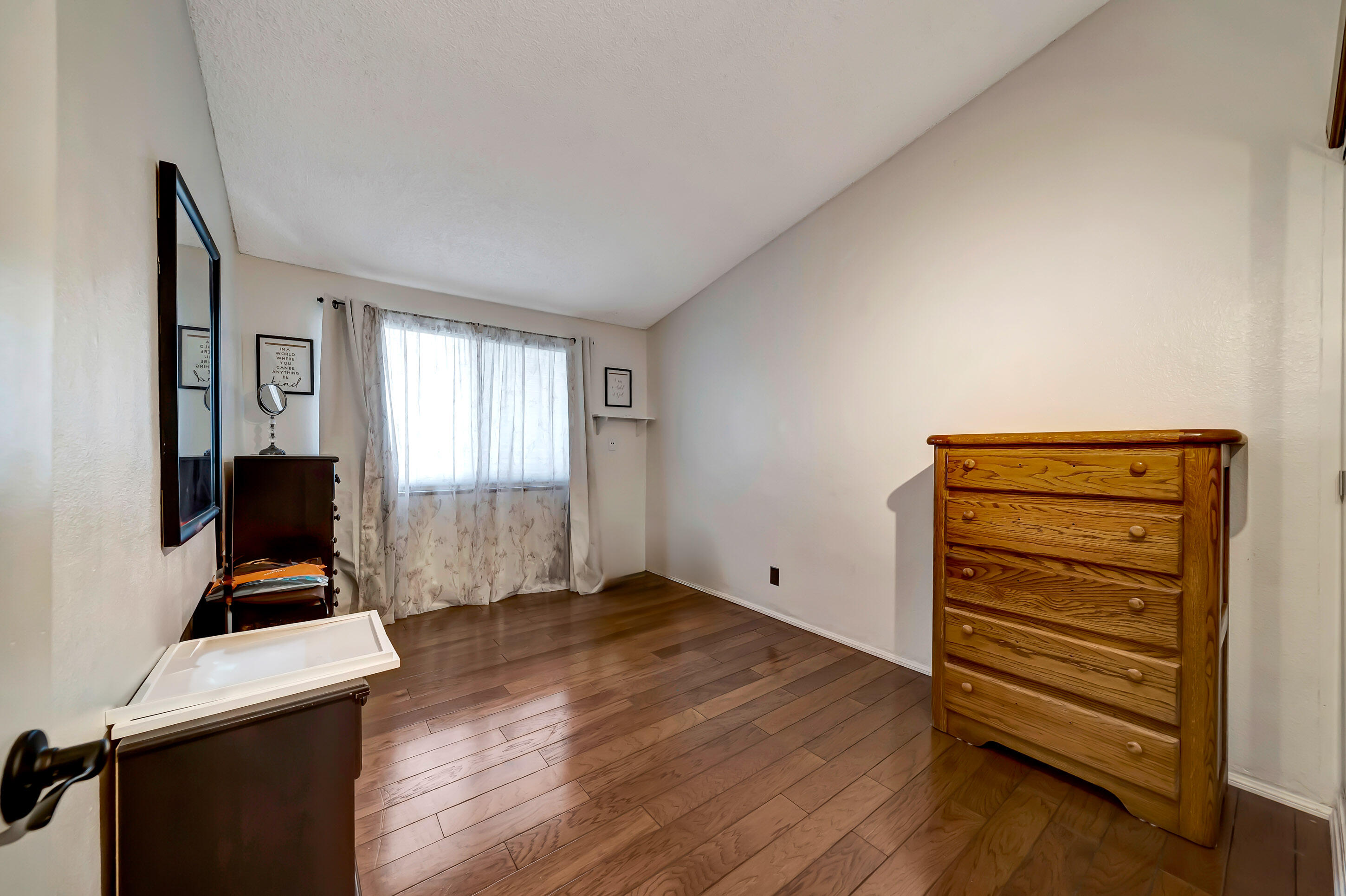 1617 Elizabeth Lake Road Palmdale, CA 93551 - Photo 27 of 45 a view of room with a flat screen tv and a window
