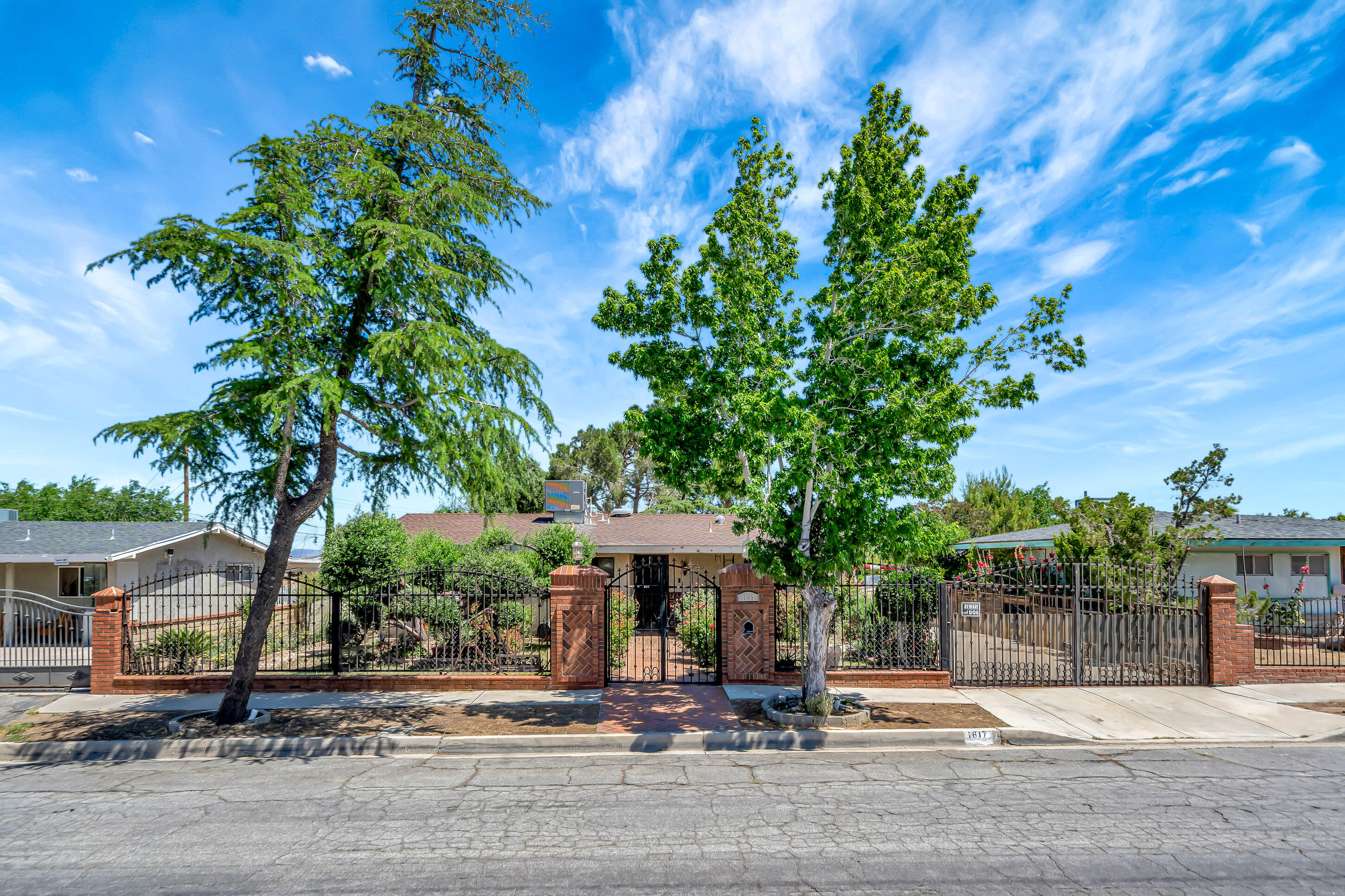 1617 Elizabeth Lake Road Palmdale, CA 93551 - Photo 3 of 45 a view of a house with a tree