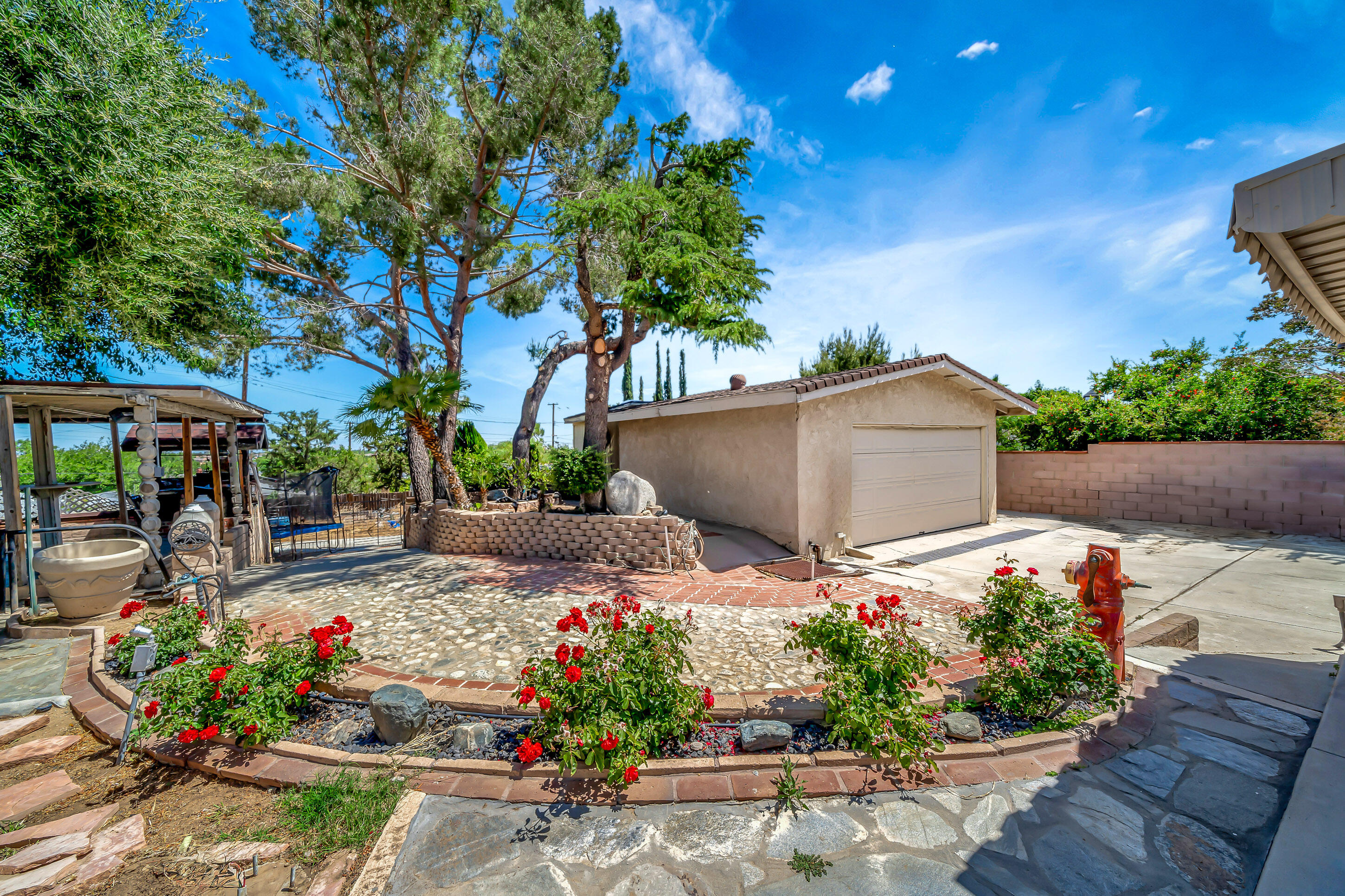 1617 Elizabeth Lake Road Palmdale, CA 93551 - Photo 32 of 45 a garden view with a seating space