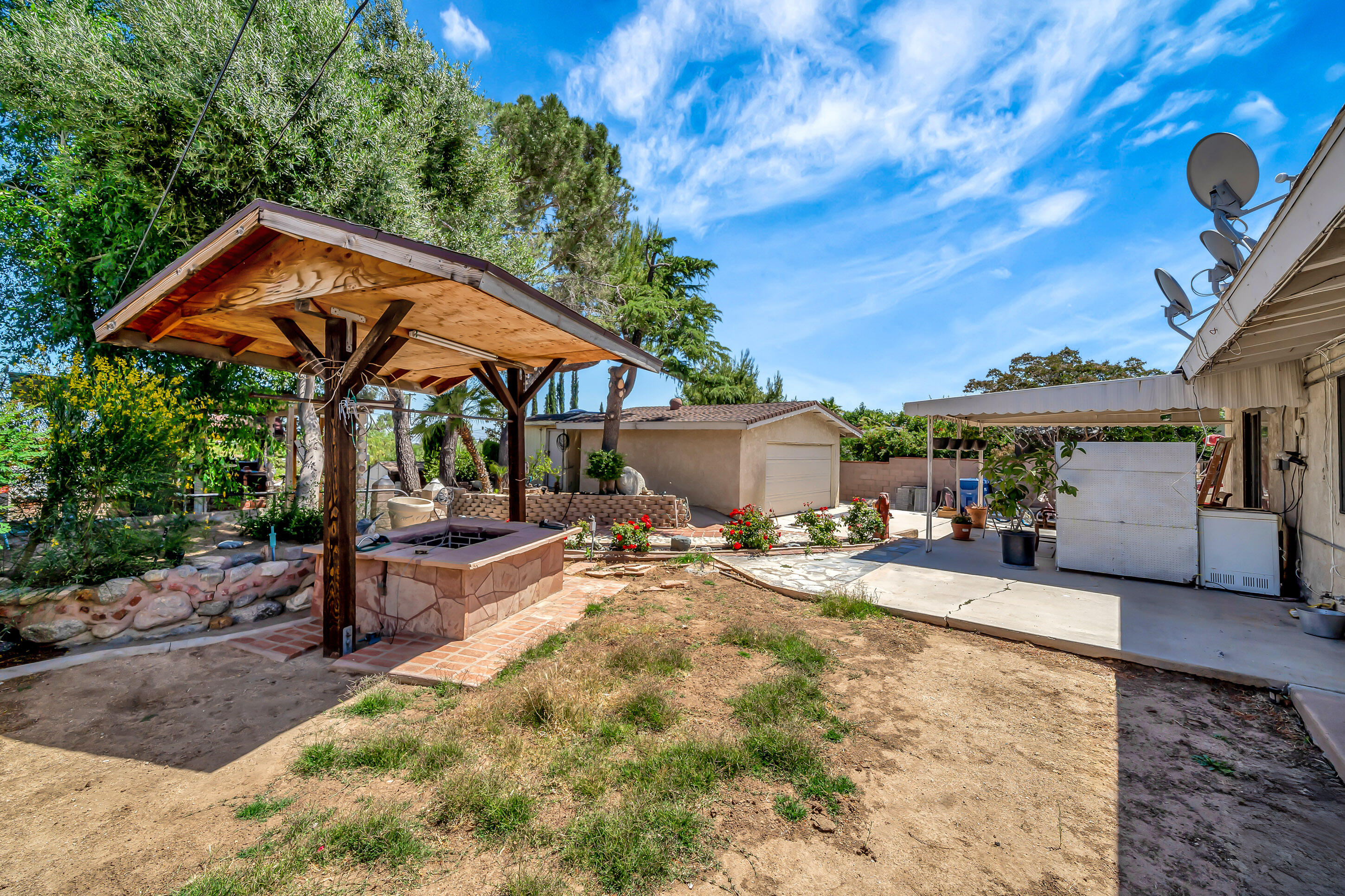 1617 Elizabeth Lake Road Palmdale, CA 93551 - Photo 34 of 45 a view of a house with backyard and sitting area