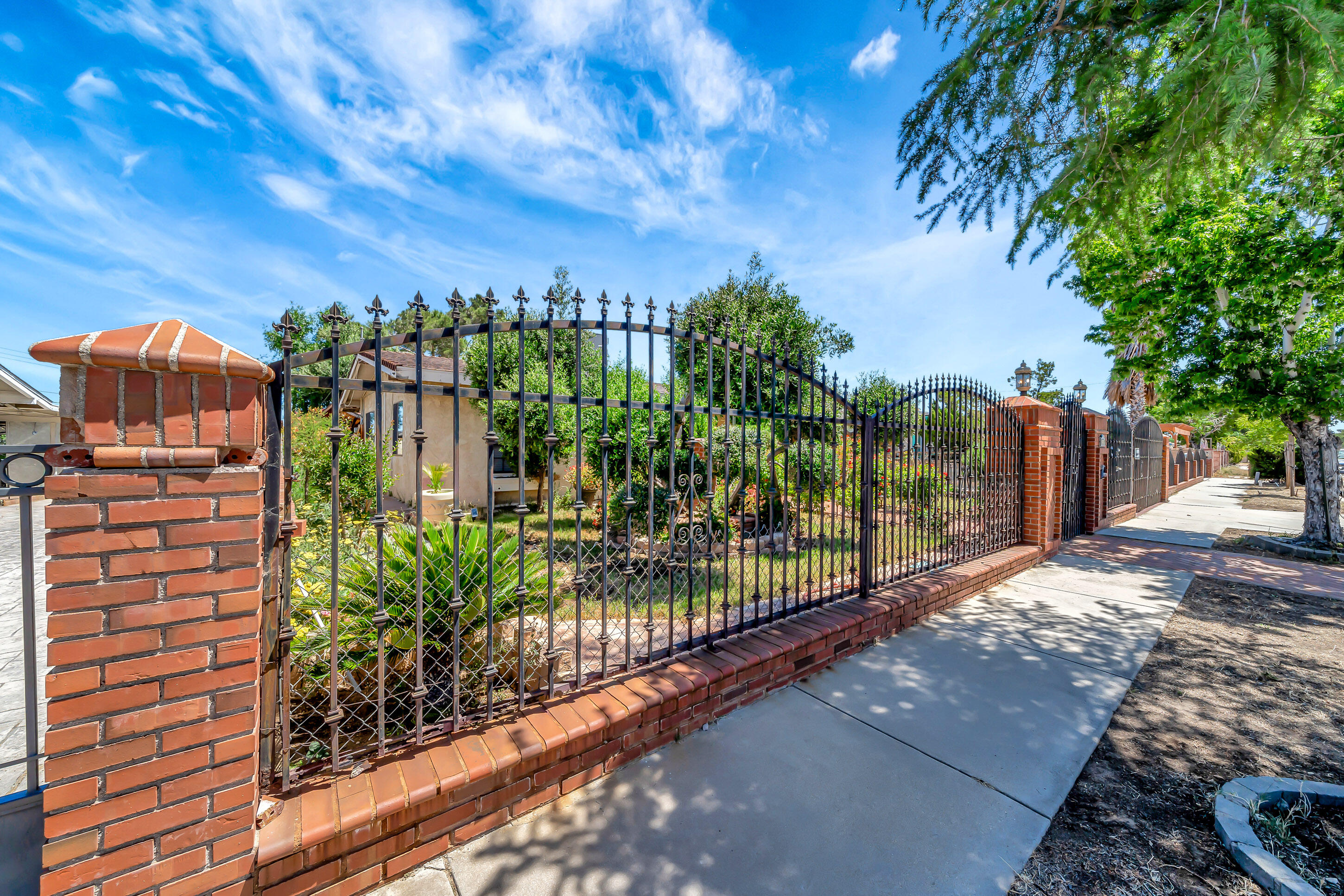 1617 Elizabeth Lake Road Palmdale, CA 93551 - Photo 44 of 45 a view of a pathway with a building in the background