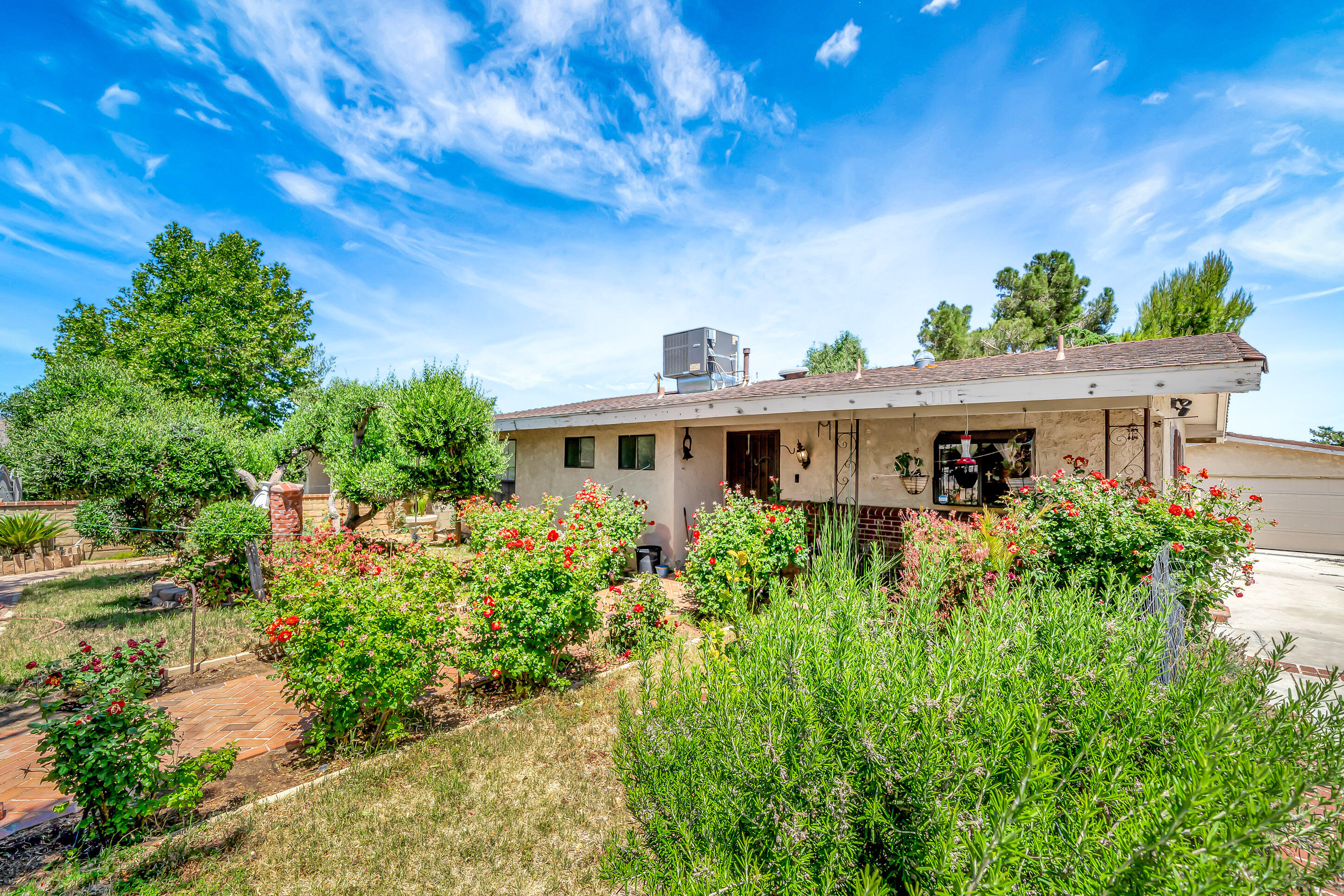 1617 Elizabeth Lake Road Palmdale, CA 93551 - Photo 5 of 45 a front view of a house with a yard