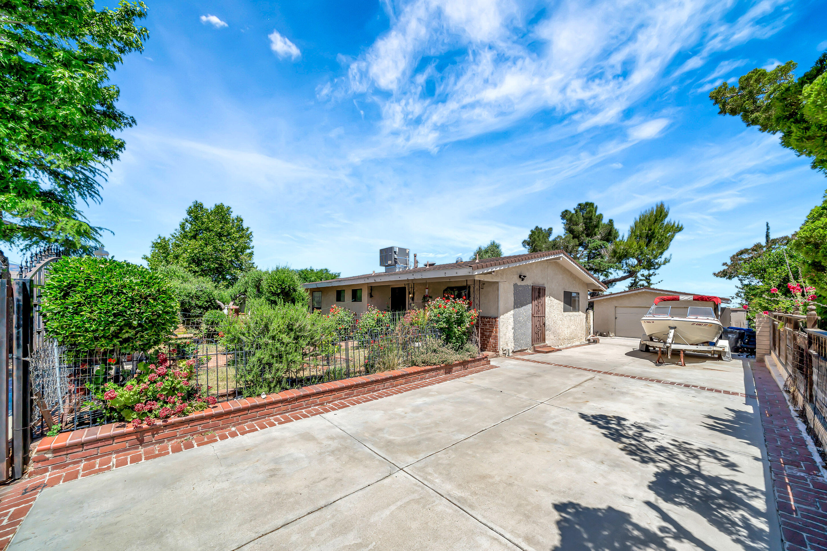 1617 Elizabeth Lake Road Palmdale, CA 93551 - Photo 8 of 45 a street view with couple of cars parked on road