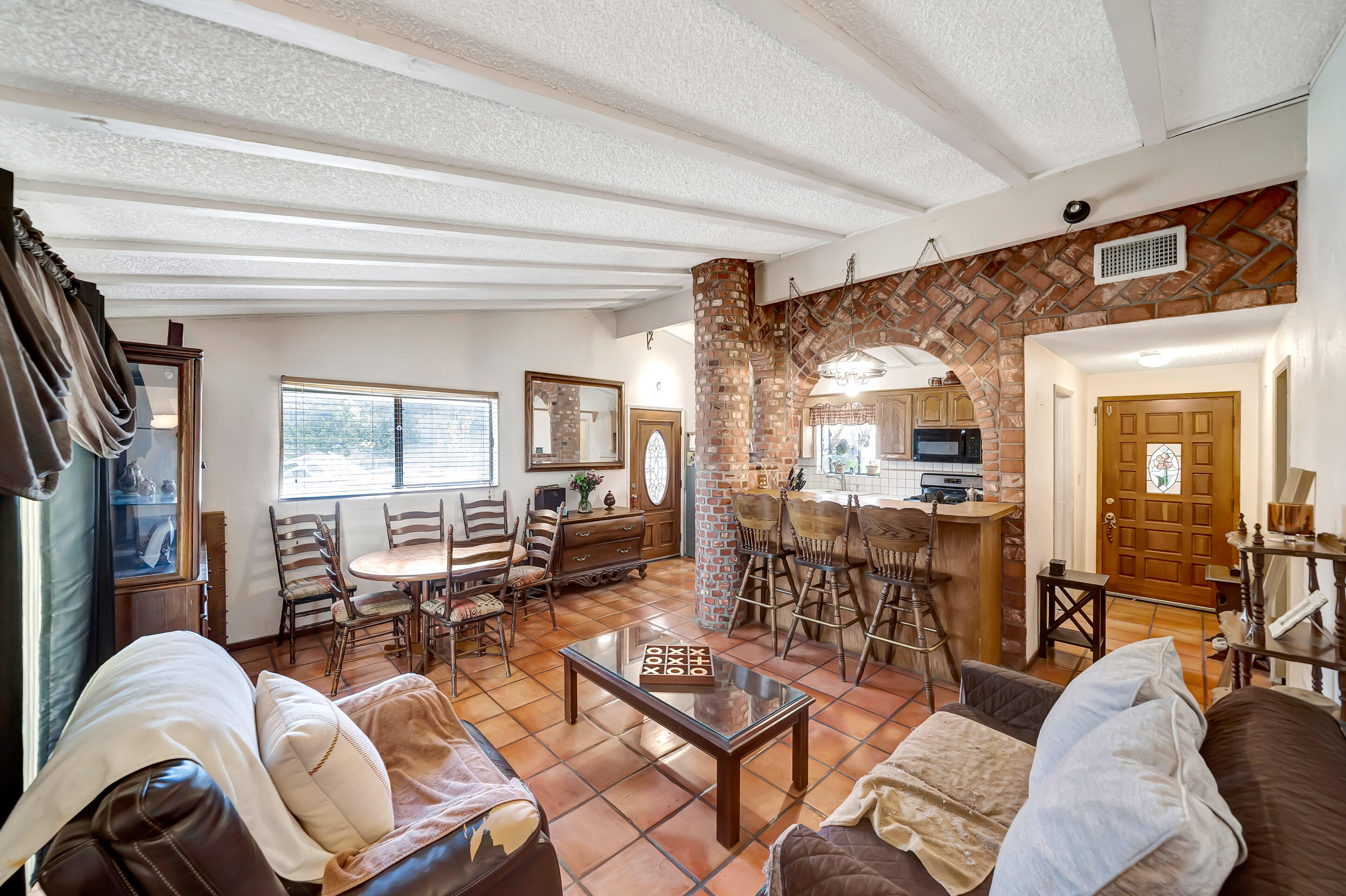 1617 Elizabeth Lake Road Palmdale, CA 93551 - Photo 10 of 45 a living room with furniture and a large window