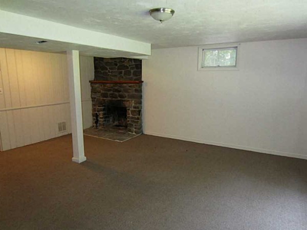 3147 Flat River Road Coventry, RI 02816 - Photo 20 of 24 an empty room with a fireplace