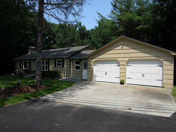 3147 Flat River Road Coventry, RI 02816 - Photo 3 of 24 a front view of a house with a yard and garage