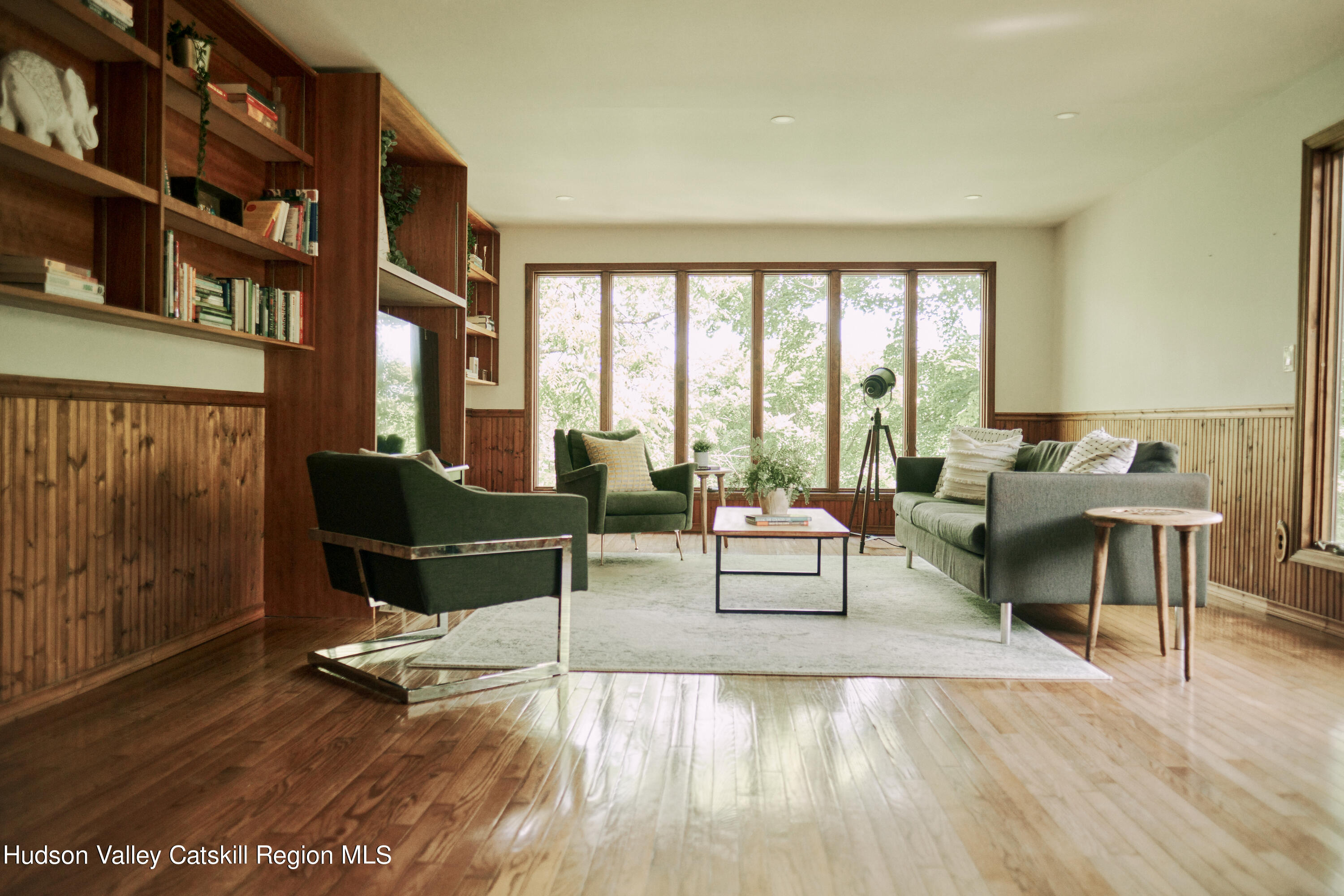 284 Dewitt Mills Road Kingston, NY 12401 - Photo 15 of 36 a living room with furniture a rug and a floor to ceiling window