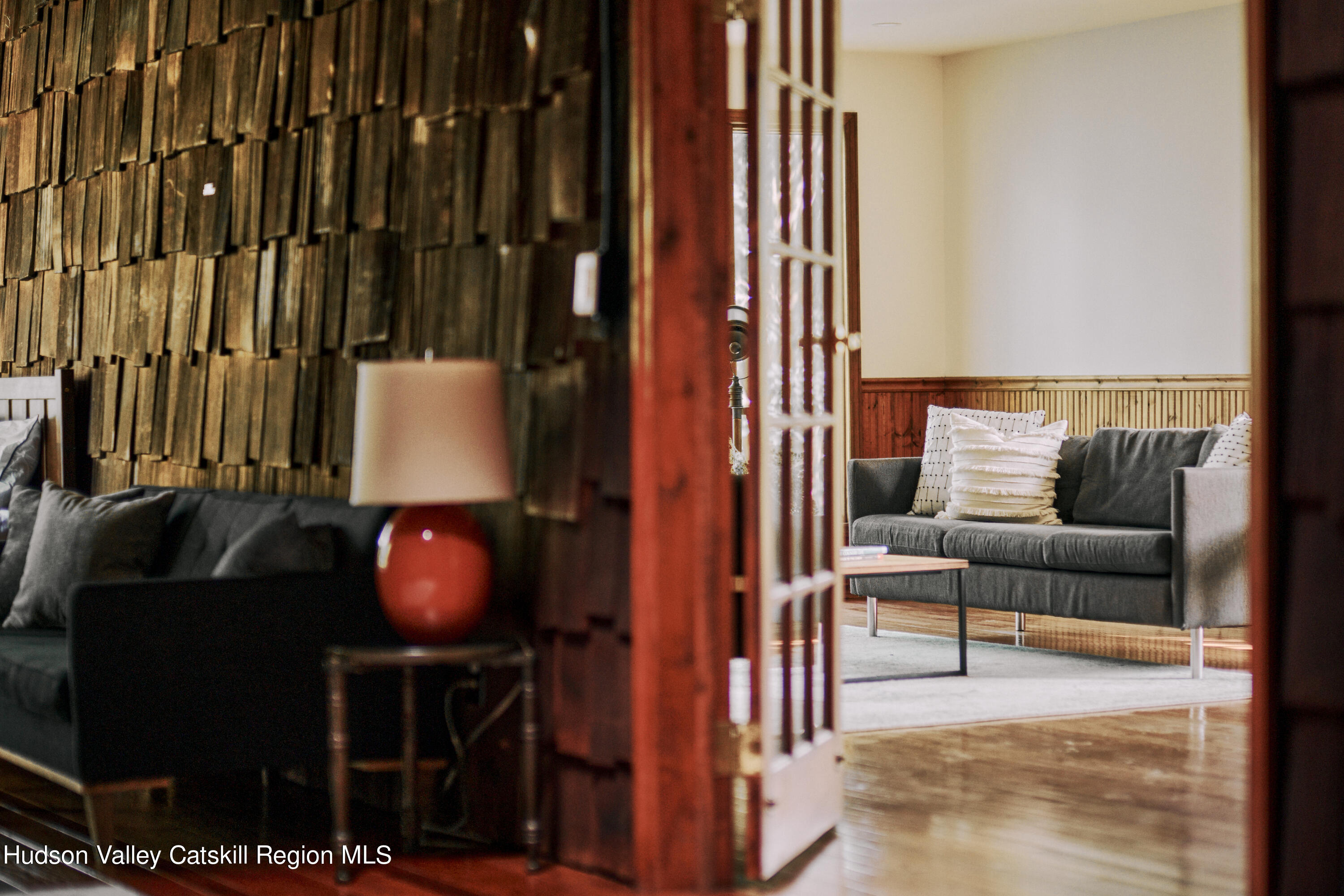 284 Dewitt Mills Road Kingston, NY 12401 - Photo 18 of 36 a living room with couches a fireplace and rug