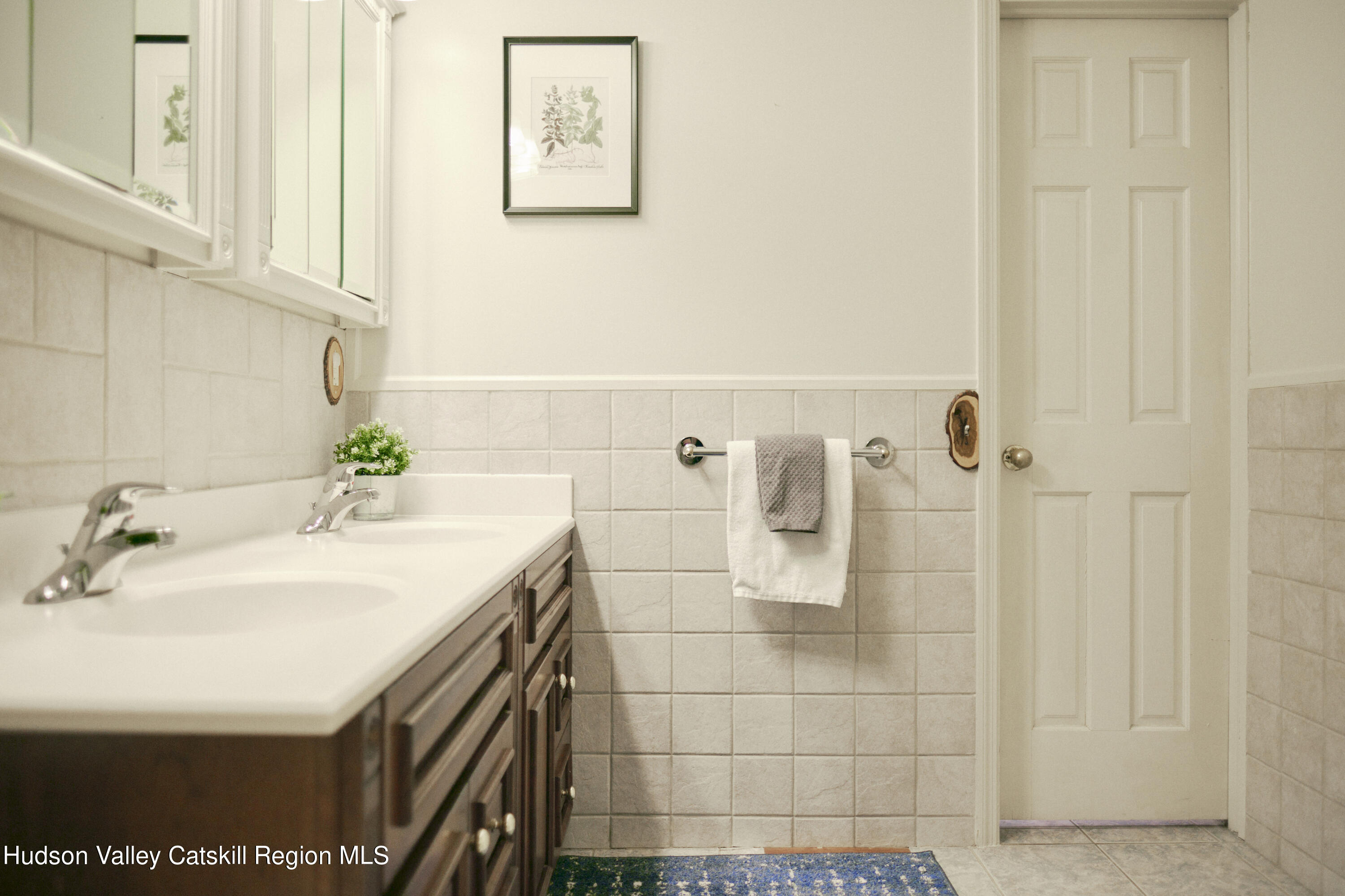 284 Dewitt Mills Road Kingston, NY 12401 - Photo 20 of 36 a bathroom with a sink a mirror and shower