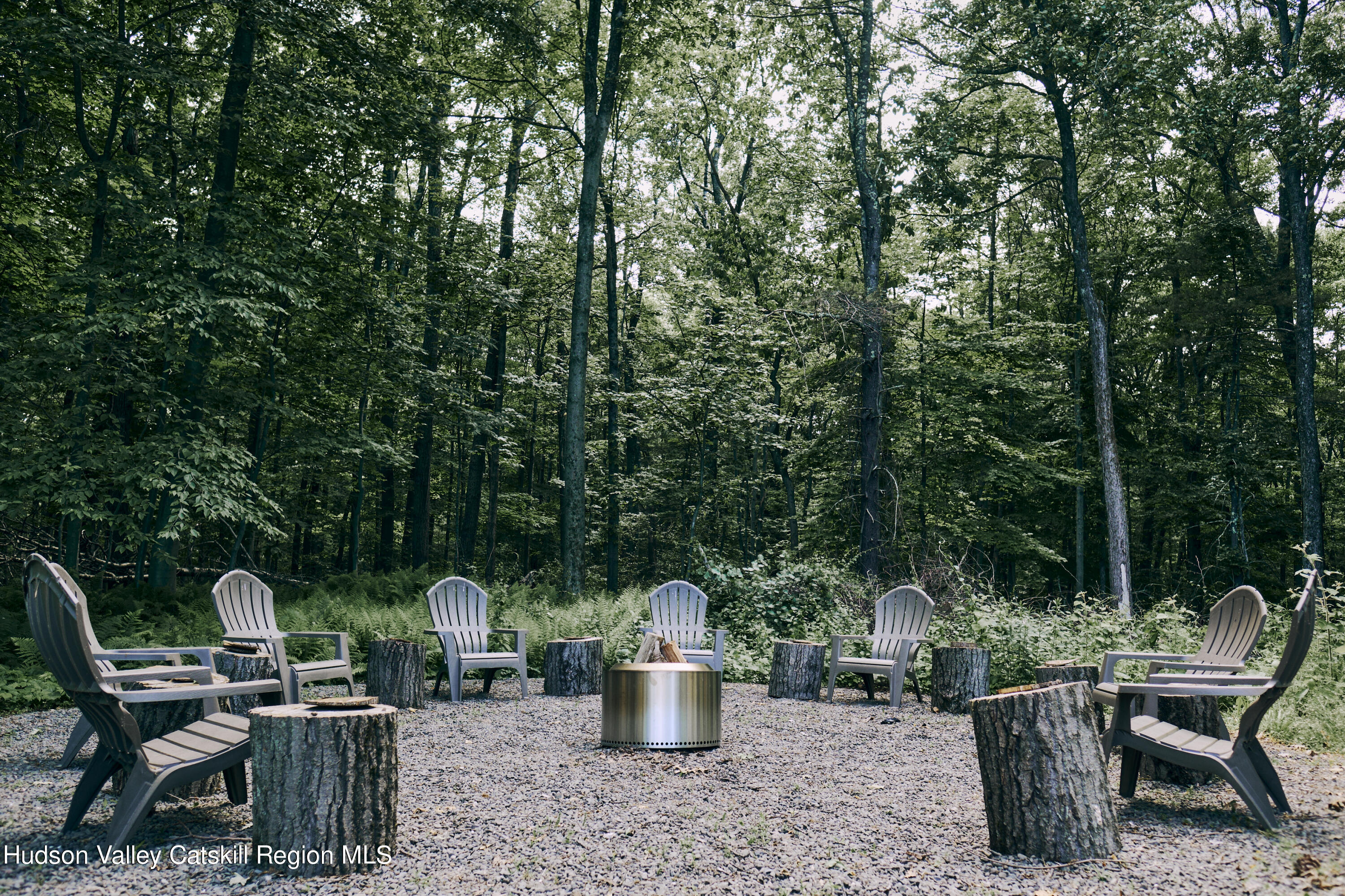 284 Dewitt Mills Road Kingston, NY 12401 - Photo 32 of 36 a view of a patio with table and chairs potted plants and swimming pool