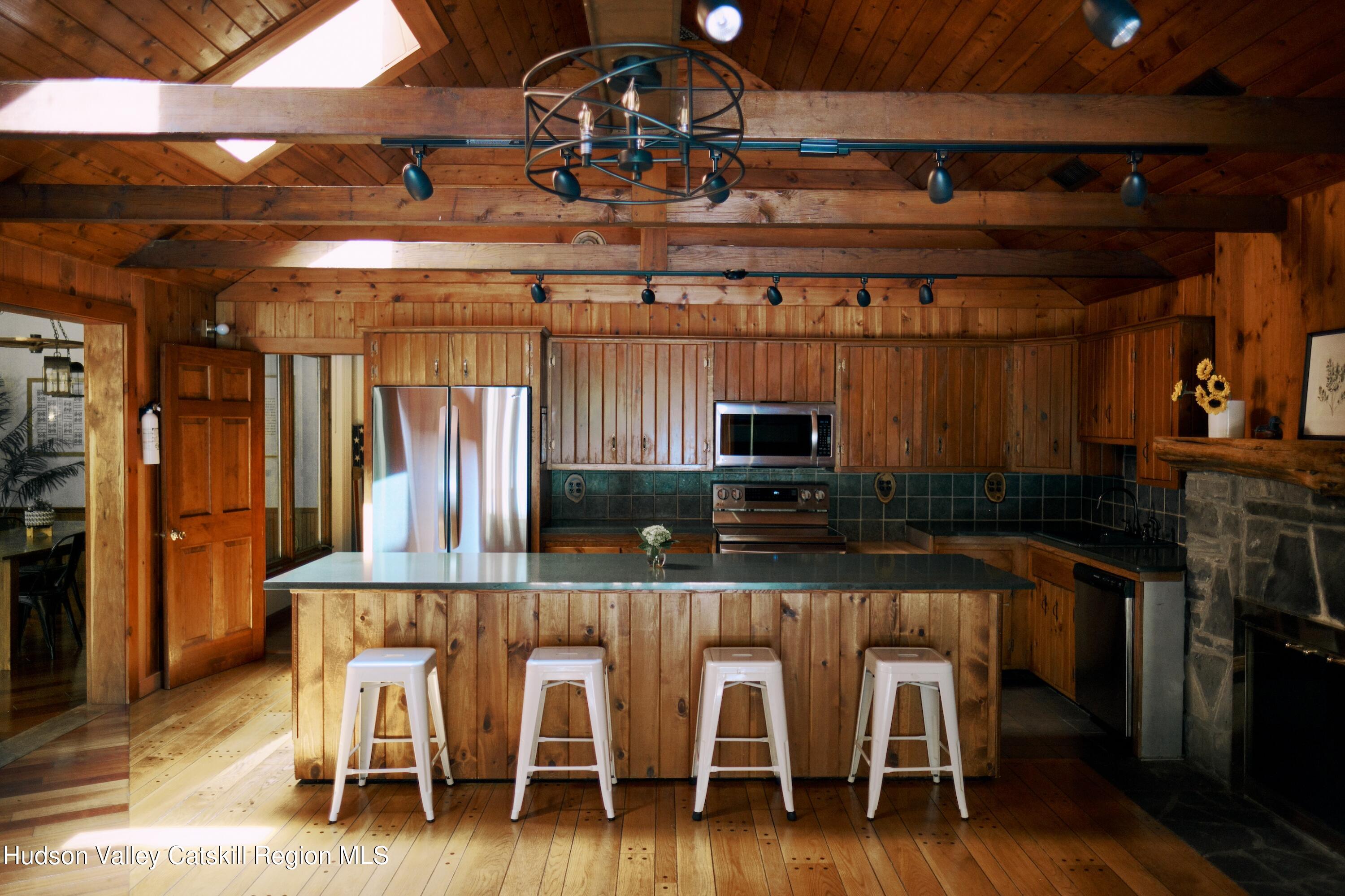 284 Dewitt Mills Road Kingston, NY 12401 - Photo 7 of 36 a dinning table and chairs in a room