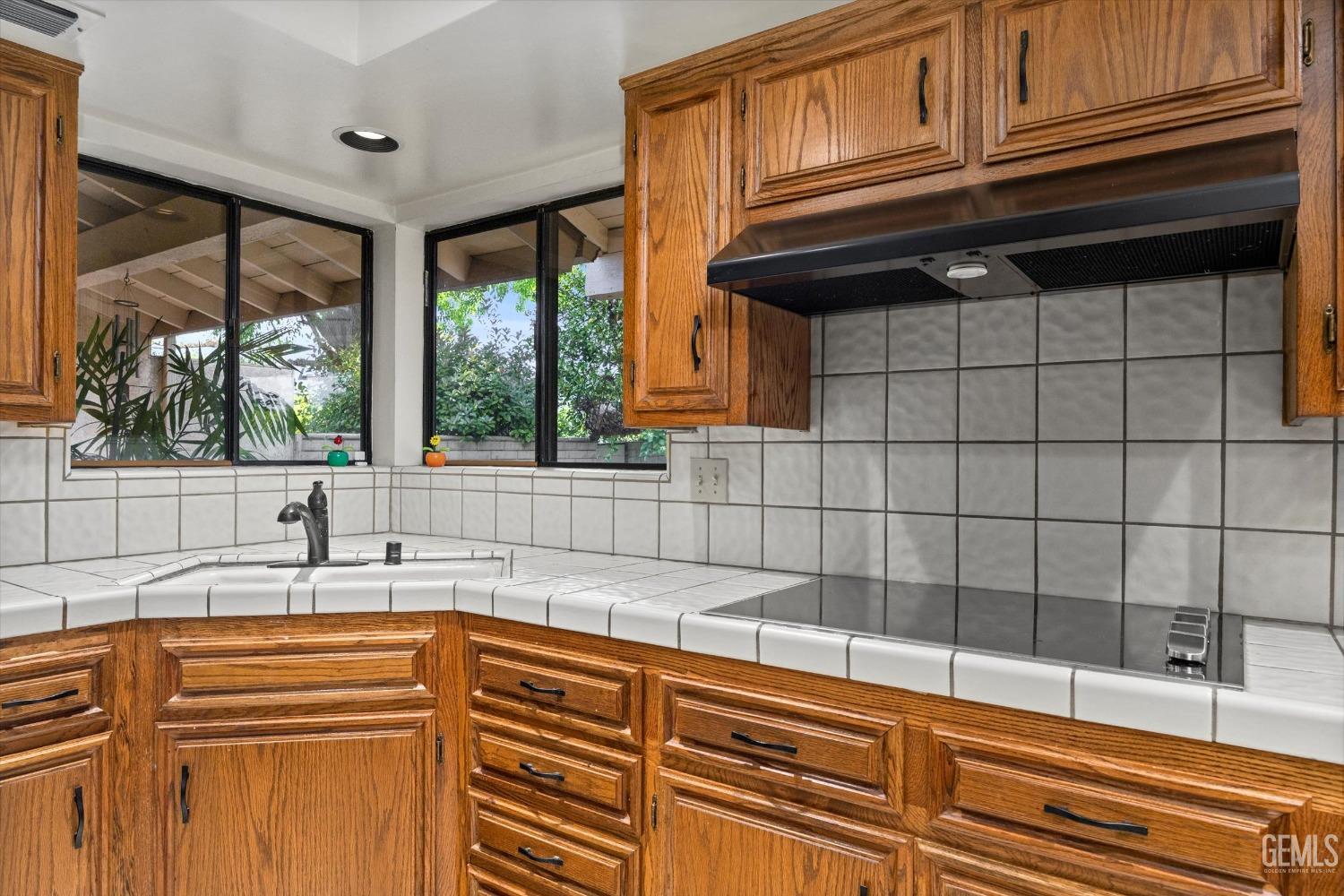 Undisclosed Address Bakersfield, CA 93309 - Photo 13 of 36 a kitchen with granite countertop a sink and a window