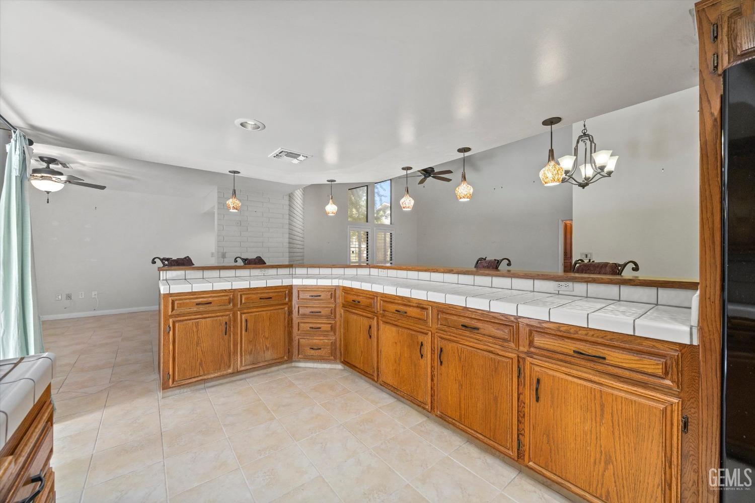 Undisclosed Address Bakersfield, CA 93309 - Photo 16 of 36 a large bathroom with a sink a large mirror and a vanity