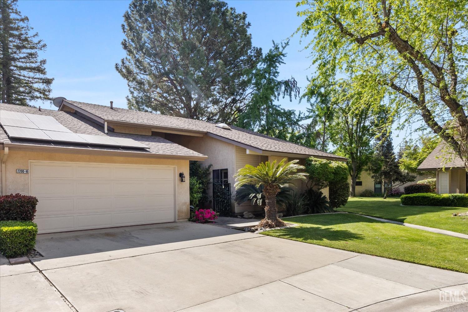 Undisclosed Address Bakersfield, CA 93309 - Photo 2 of 36 a view of a house with backyard and a tree