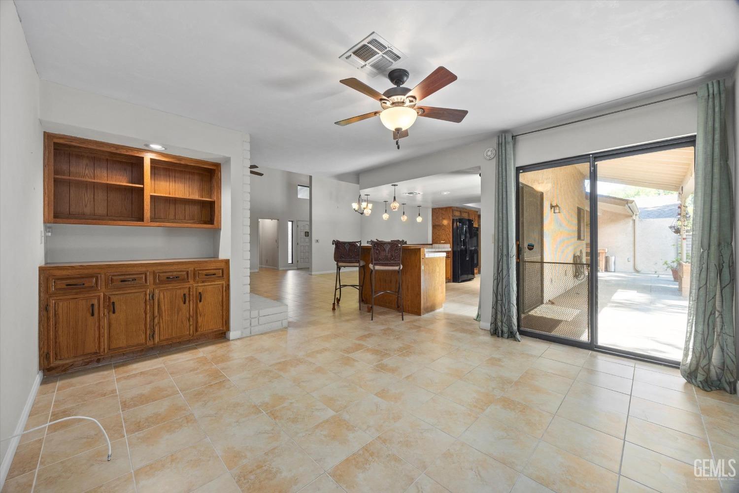 Undisclosed Address Bakersfield, CA 93309 - Photo 27 of 36 a view of an empty room with a kitchen