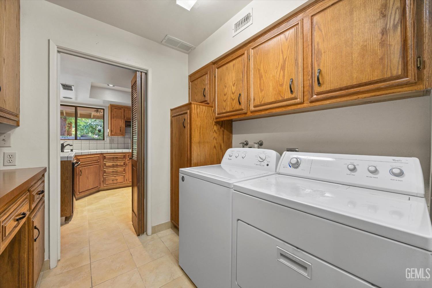 Undisclosed Address Bakersfield, CA 93309 - Photo 28 of 36 a utility room with dryer and washer