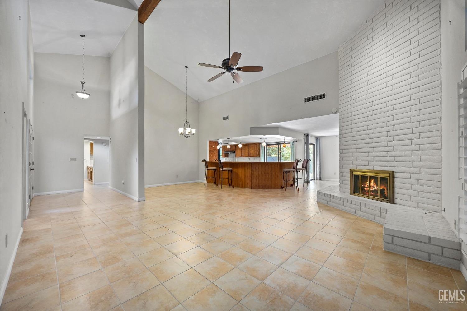 Undisclosed Address Bakersfield, CA 93309 - Photo 6 of 36 a view of a kitchen with a sink and a fireplace