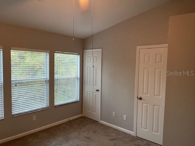 803 Shropshire Loop Sanford, FL 32771 - Photo 15 of 29 an empty room with windows and closet