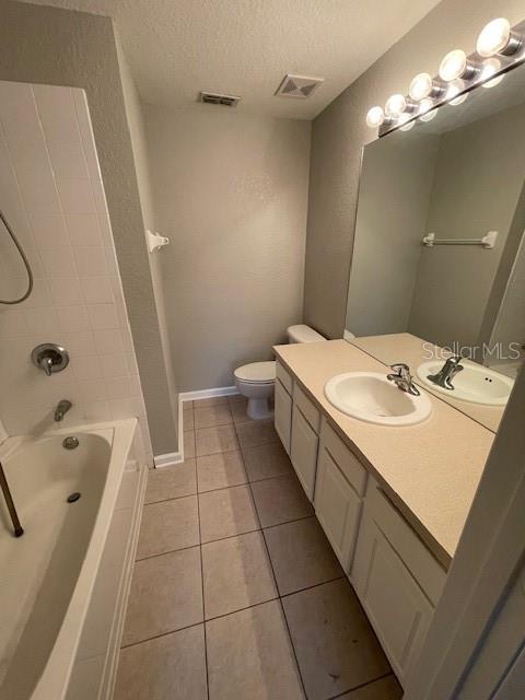 803 Shropshire Loop Sanford, FL 32771 - Photo 16 of 29 a bathroom with a double vanity sink a toilet and shower