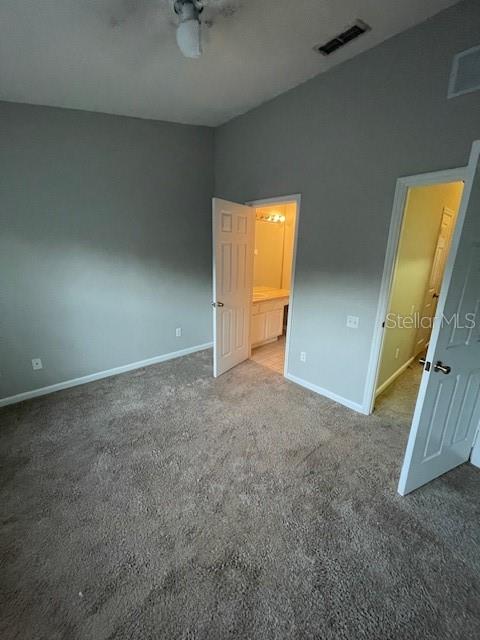 803 Shropshire Loop Sanford, FL 32771 - Photo 18 of 29 an empty room with a wooden floor and windows