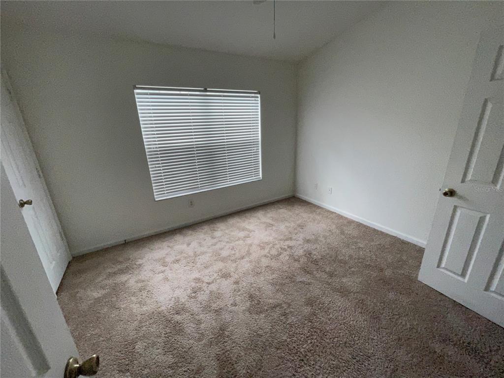 803 Shropshire Loop Sanford, FL 32771 - Photo 20 of 29 a view of an empty room with a window