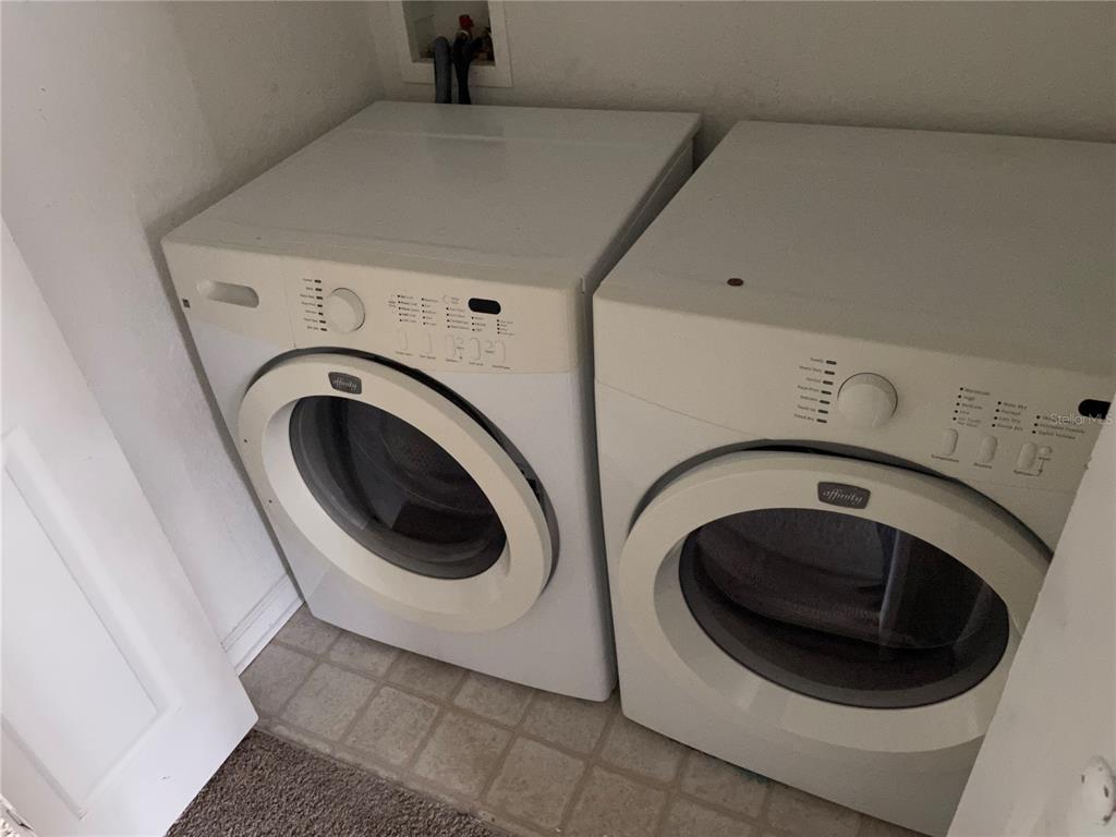 803 Shropshire Loop Sanford, FL 32771 - Photo 27 of 29 a utility room with dryer and washer