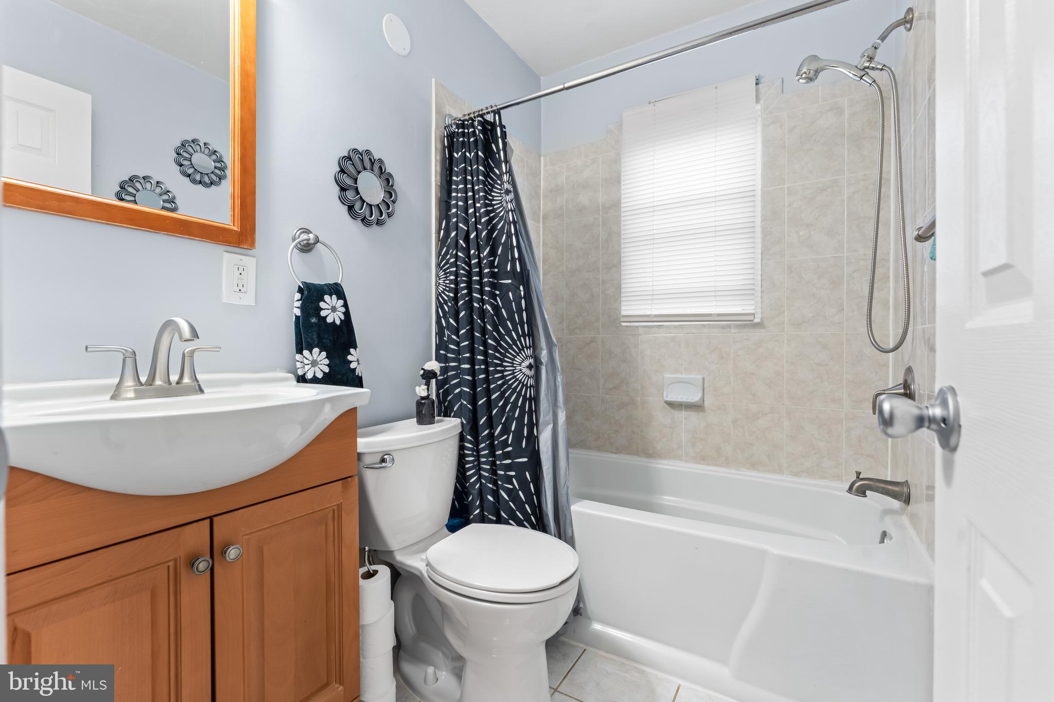 939 Clovis Avenue Capitol Heights, MD 20743 - Photo 12 of 25 a bathroom with a sink toilet and shower