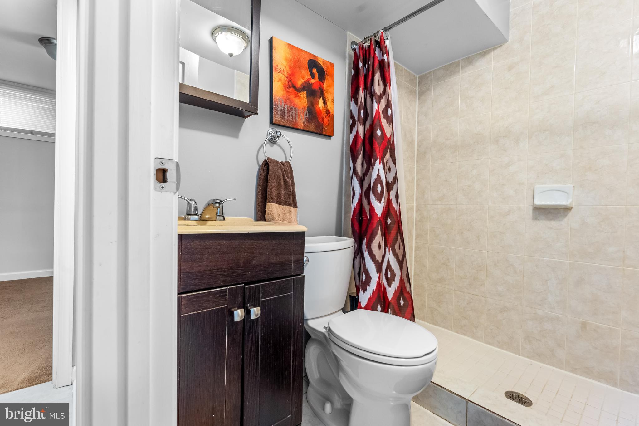 939 Clovis Avenue Capitol Heights, MD 20743 - Photo 15 of 25 a bathroom with a sink toilet and shower