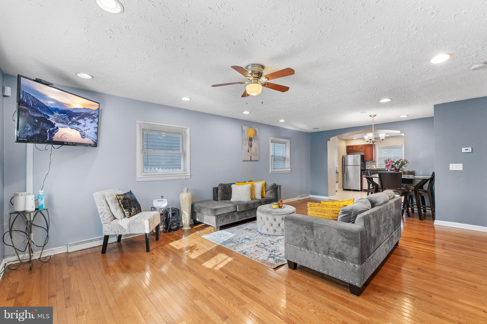 939 Clovis Avenue Capitol Heights, MD 20743 - Photo 3 of 25 a living room with furniture and wooden floor