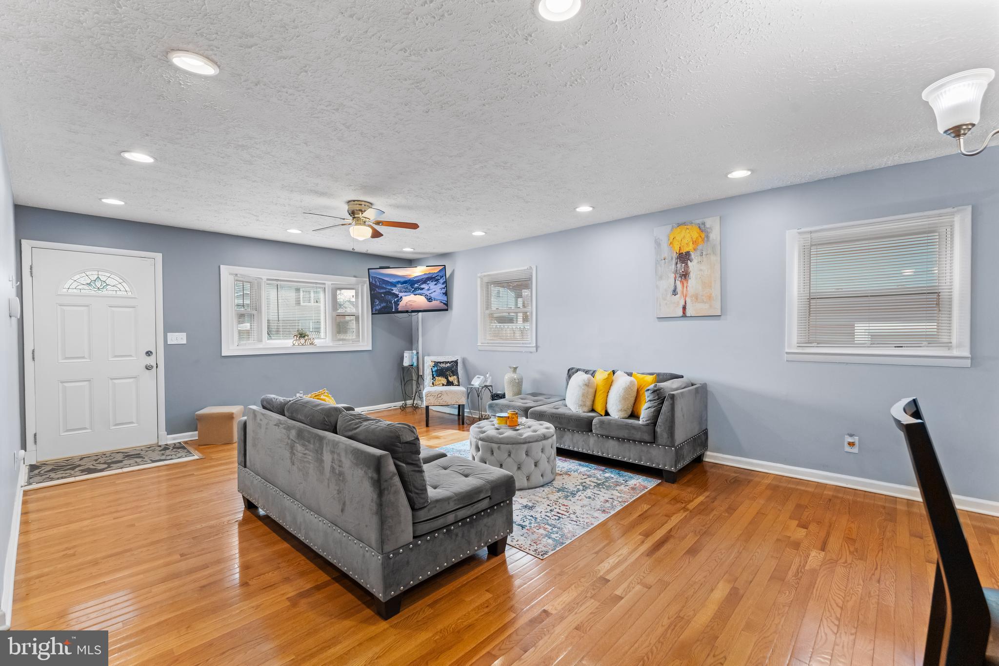 939 Clovis Avenue Capitol Heights, MD 20743 - Photo 4 of 25 a living room with furniture and a wooden floor